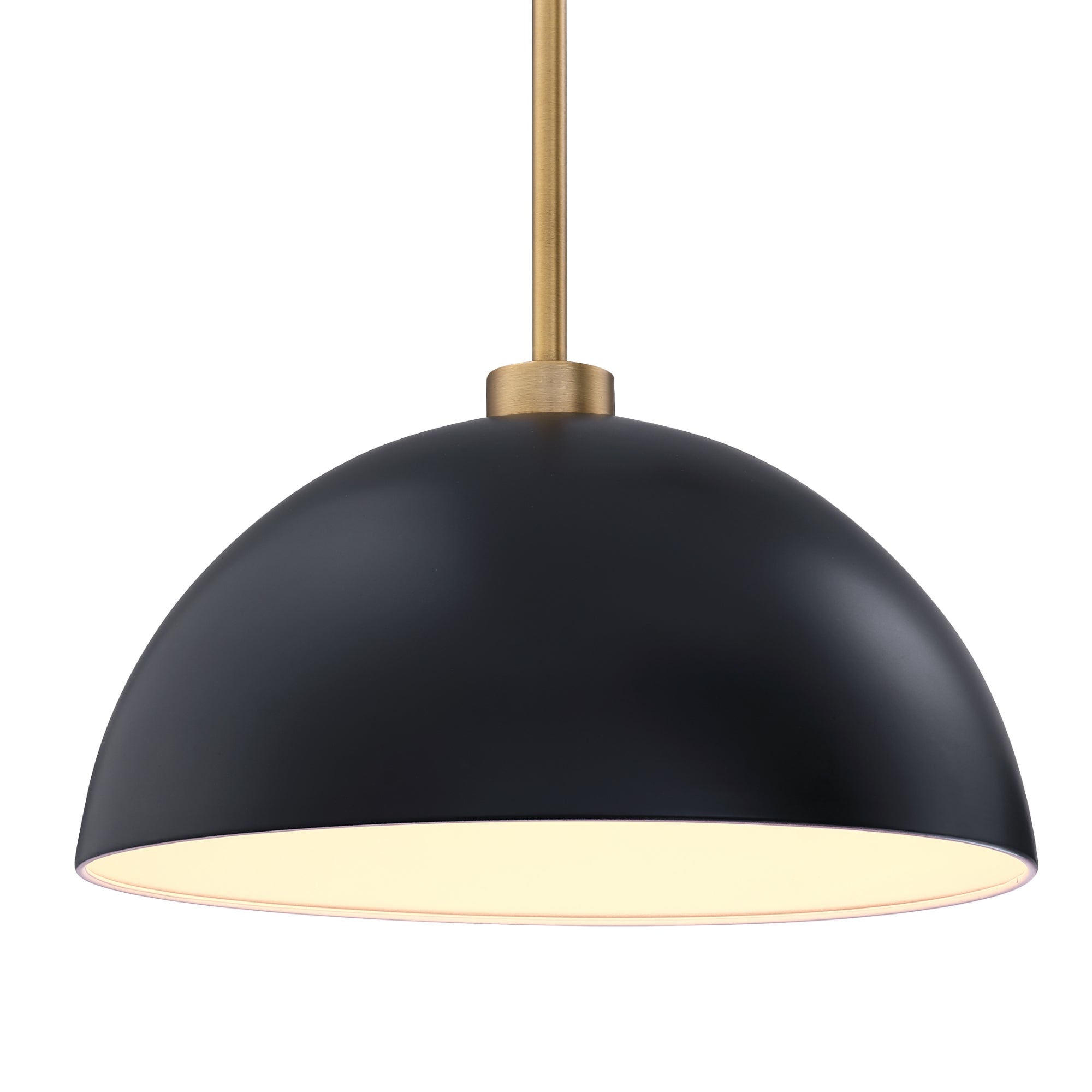 A modern pendant light with a matte black dome-shaped shade and a brass rod, shown lit with a warm glow inside the shade.