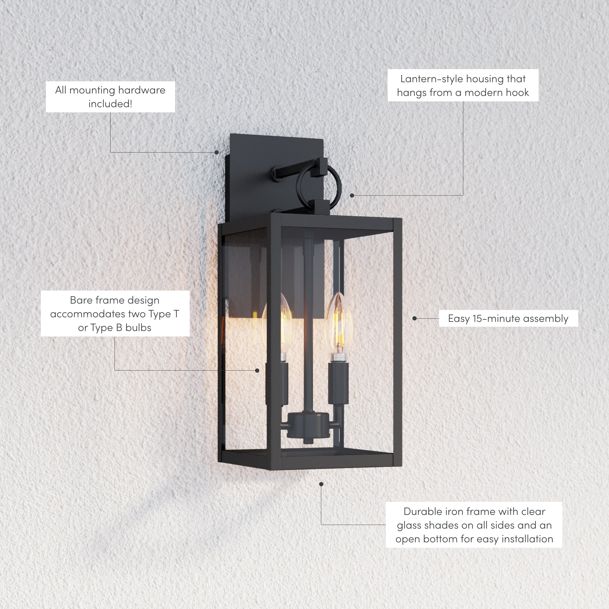 Black wall-mounted lantern with clear glass panels, two candle-style bulbs, and labeled features: mounting hardware included, lantern-style housing, easy 15-minute assembly, bare frame design, and durable iron frame.