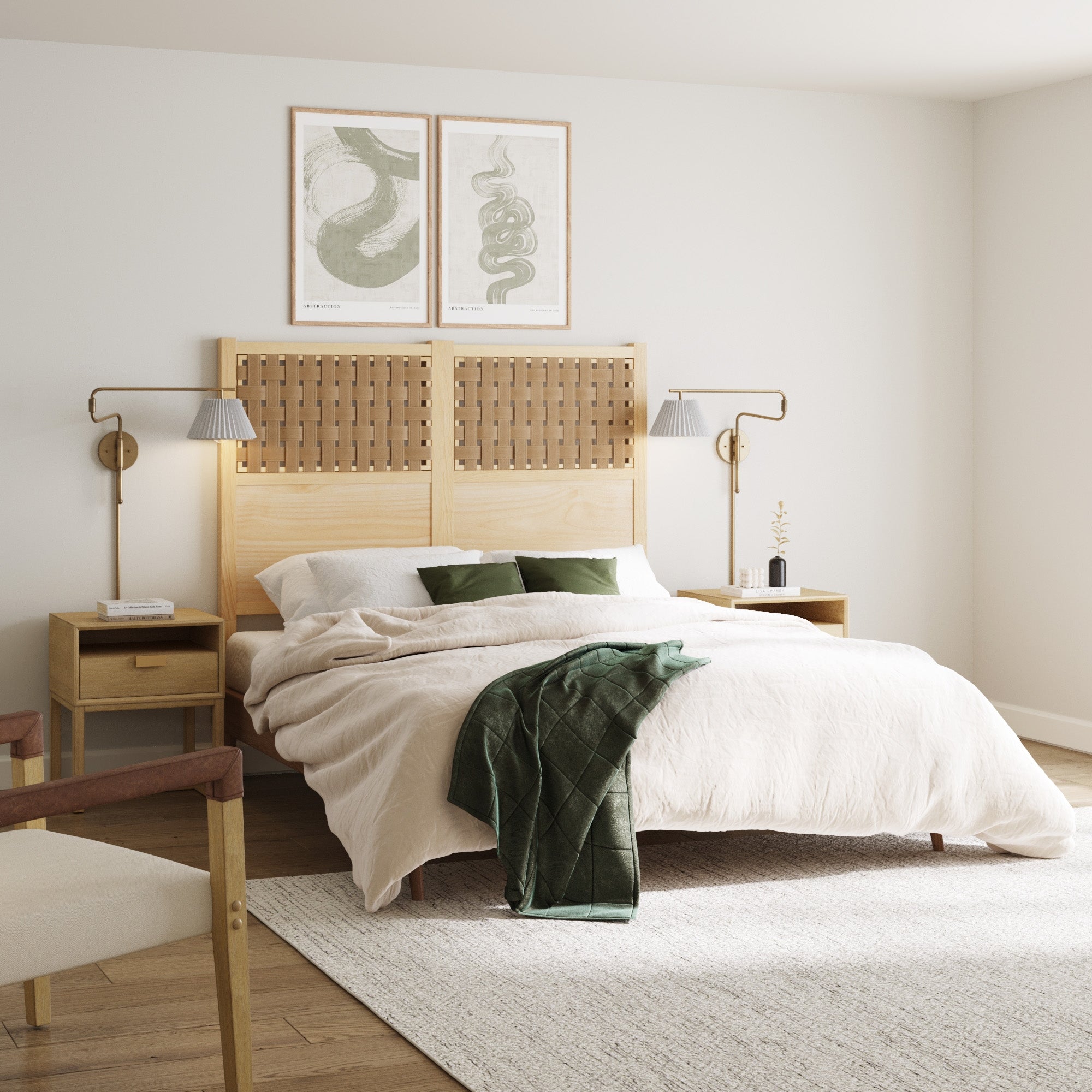 A cozy bedroom features a bed with a woven wooden headboard, beige bedding, green pillows and blanket, matching nightstands, and a Nathan James Metal Swing Arm Plug-in Wall Light Brass with a white pleated fabric shade illuminating minimalist wall art.