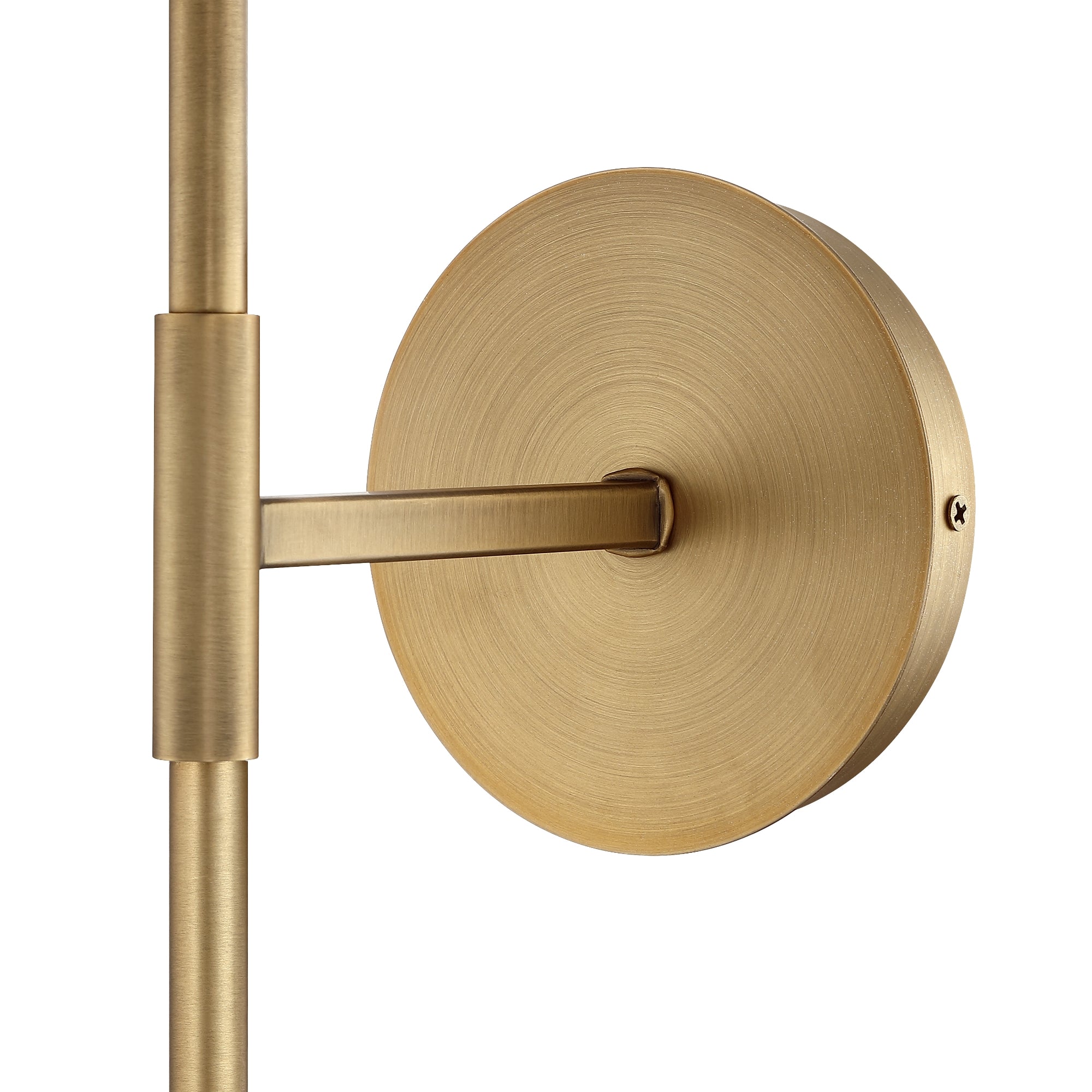 Close-up of a modern wall sconce with a brushed brass finish, featuring a round backplate and a straight arm extending to the left. The design is minimalistic and sleek.