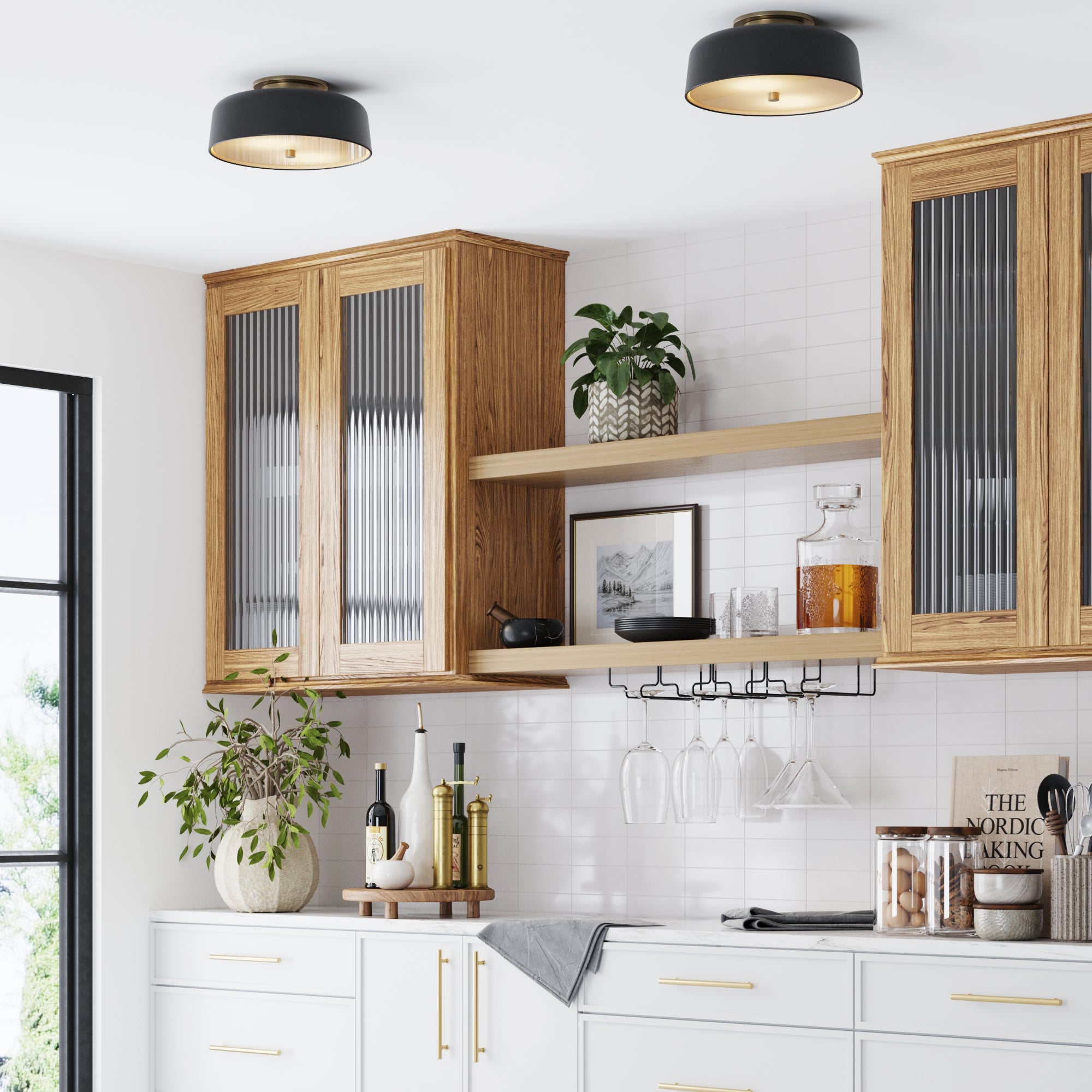 Modern kitchen with wooden cabinets, glass doors, white countertops, and backsplash. Two Nathan James Mid-Century Flush Mount Ceiling Lights (black, set of 2) with frosted diffusers brighten the space decorated with plants and jars. Light enters from the left window.