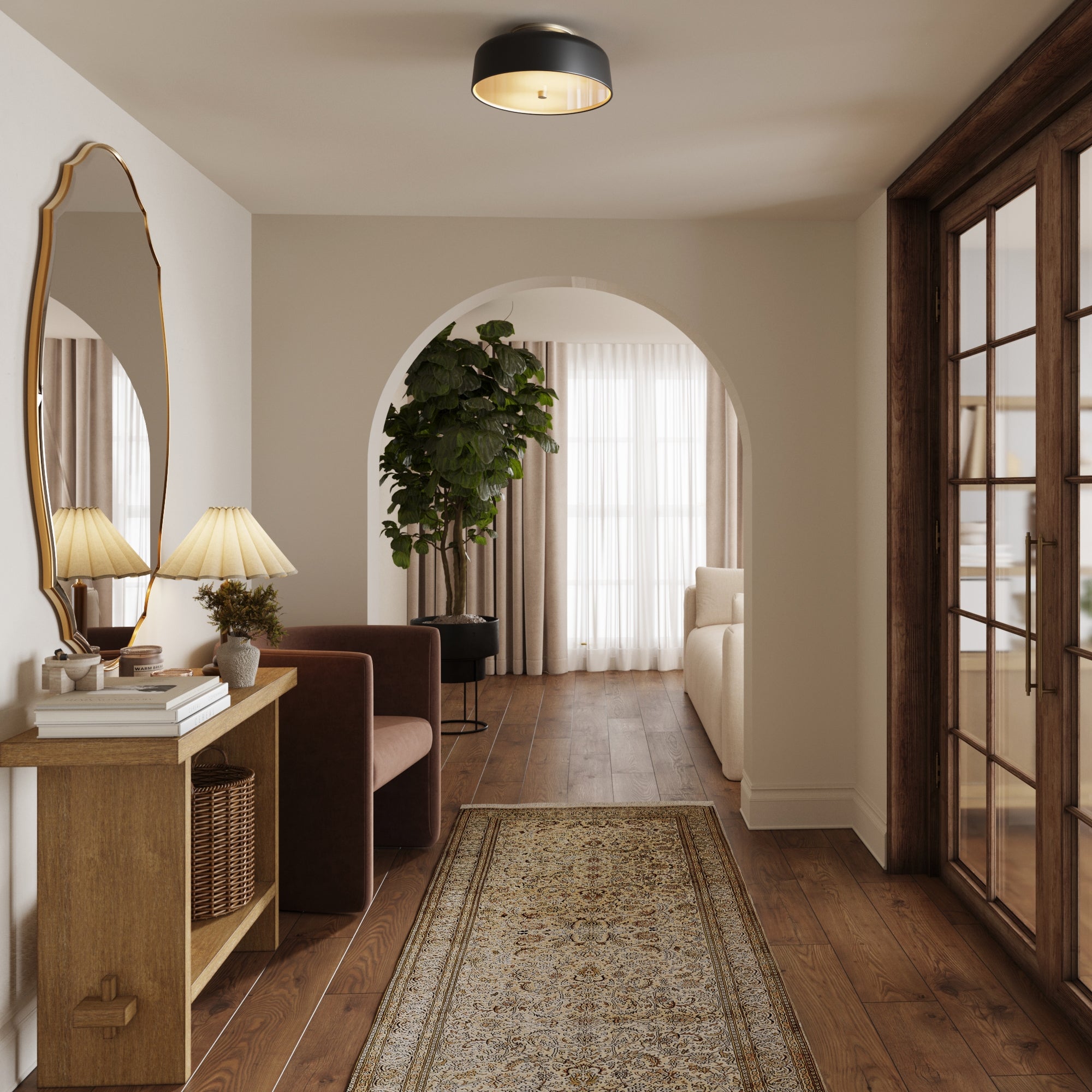 A cozy hallway with wooden floors, a patterned rug, console table and decor, a potted plant, arched doorway, and the Mid-Century Flush Mount Ceiling Light by Nathan James. Double glass doors open to a sunlit living room with curtains.