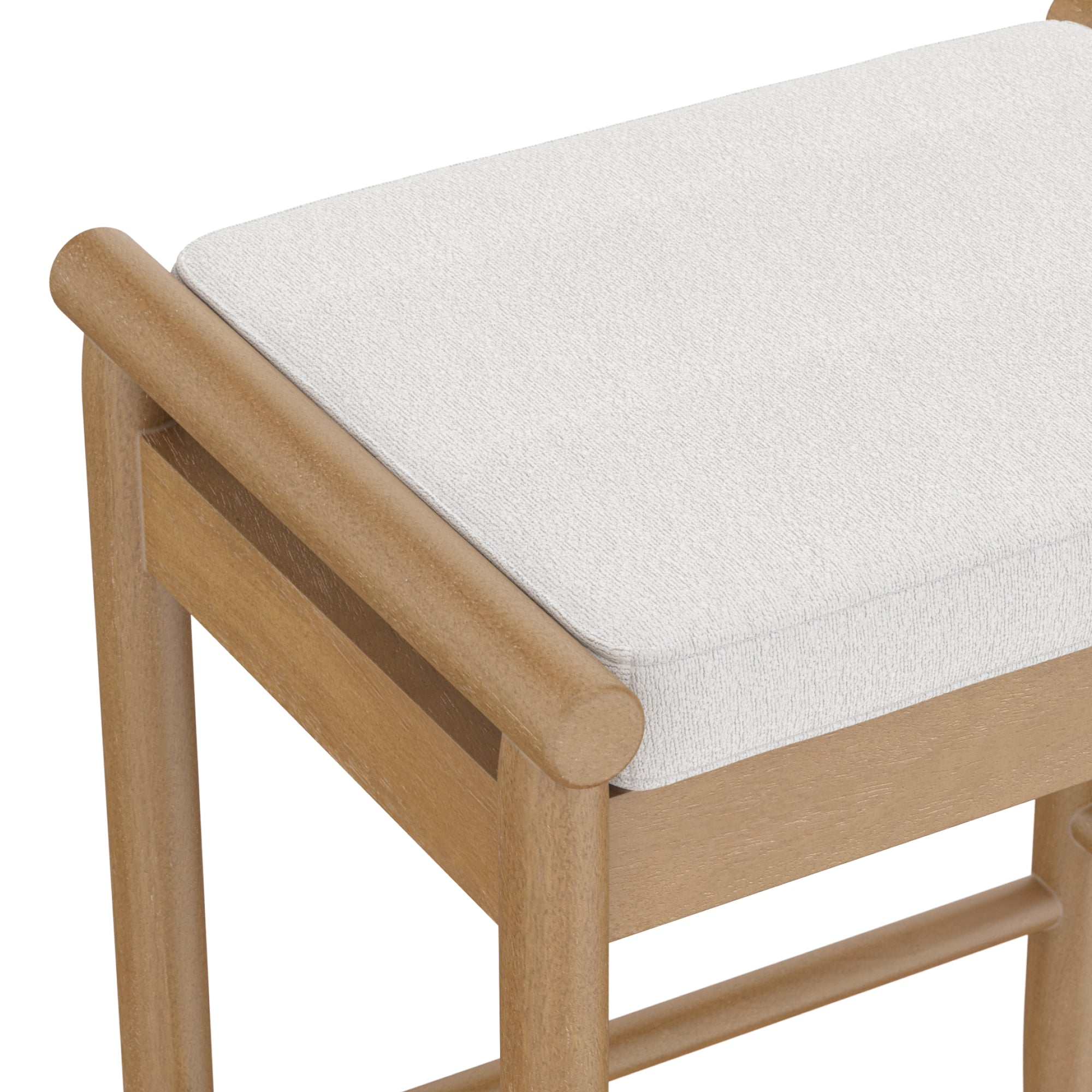 A close-up of a wooden chair with a light-colored cushioned seat, showing the smooth, rounded edges of the chair’s backrest and sturdy wooden frame.