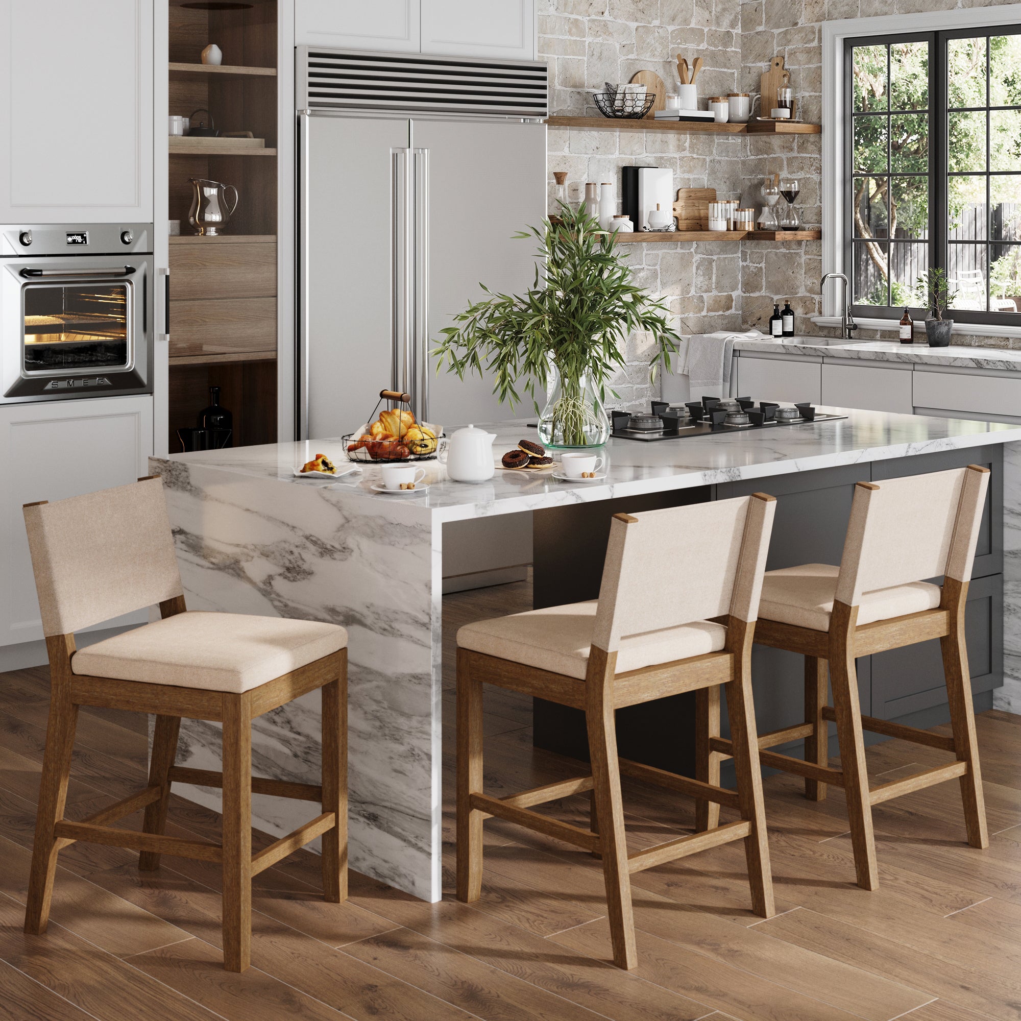 Modern farmhouse kitchen with a marble island, Nathan James Wood Counter Height Bar Stools in light brown flax (set of 3), breakfast items on the counter, built-in oven, open shelves with dishes, and a large window bringing in natural light.