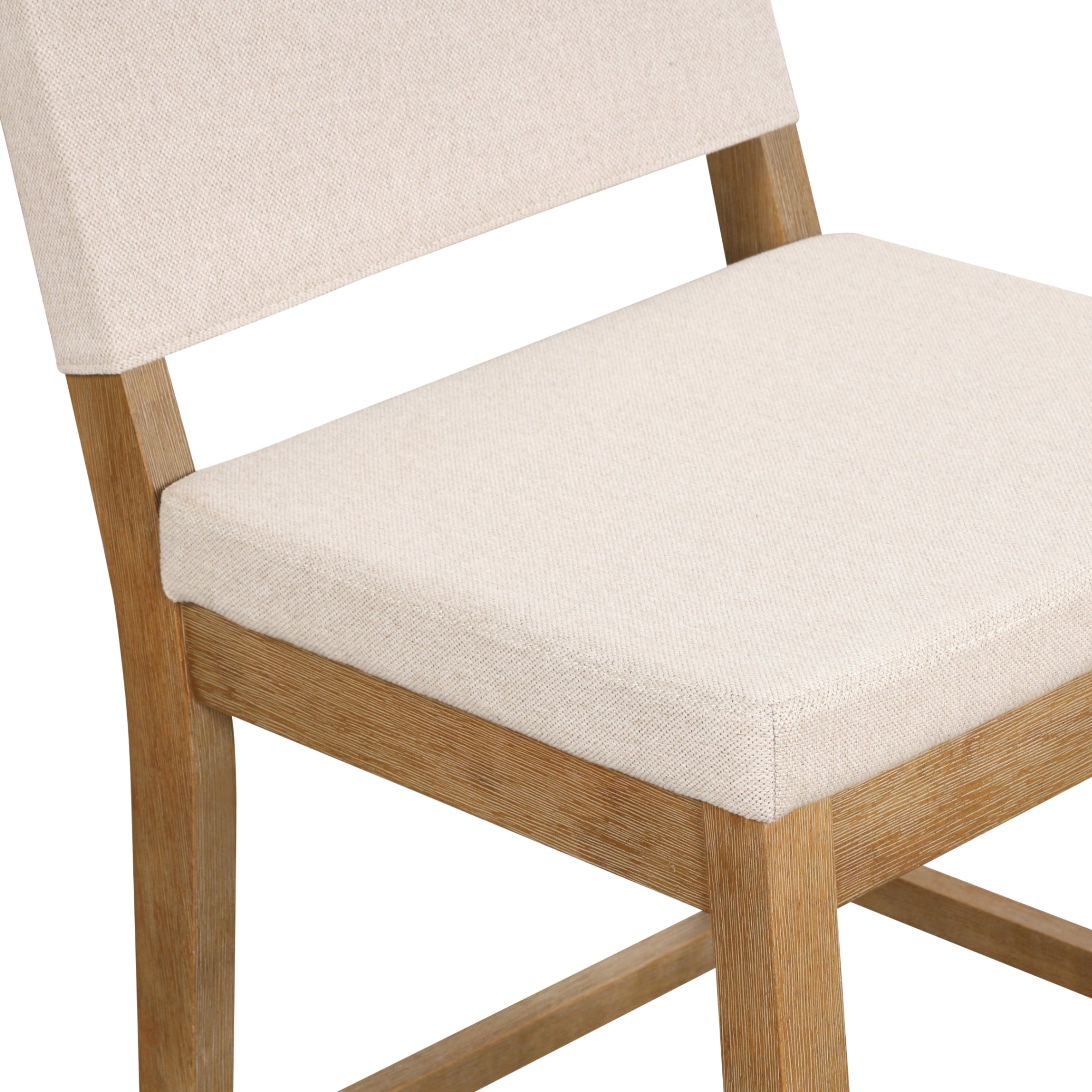A close-up view of a wooden chair with a light beige cushioned seat and backrest, highlighting the simple and modern design.