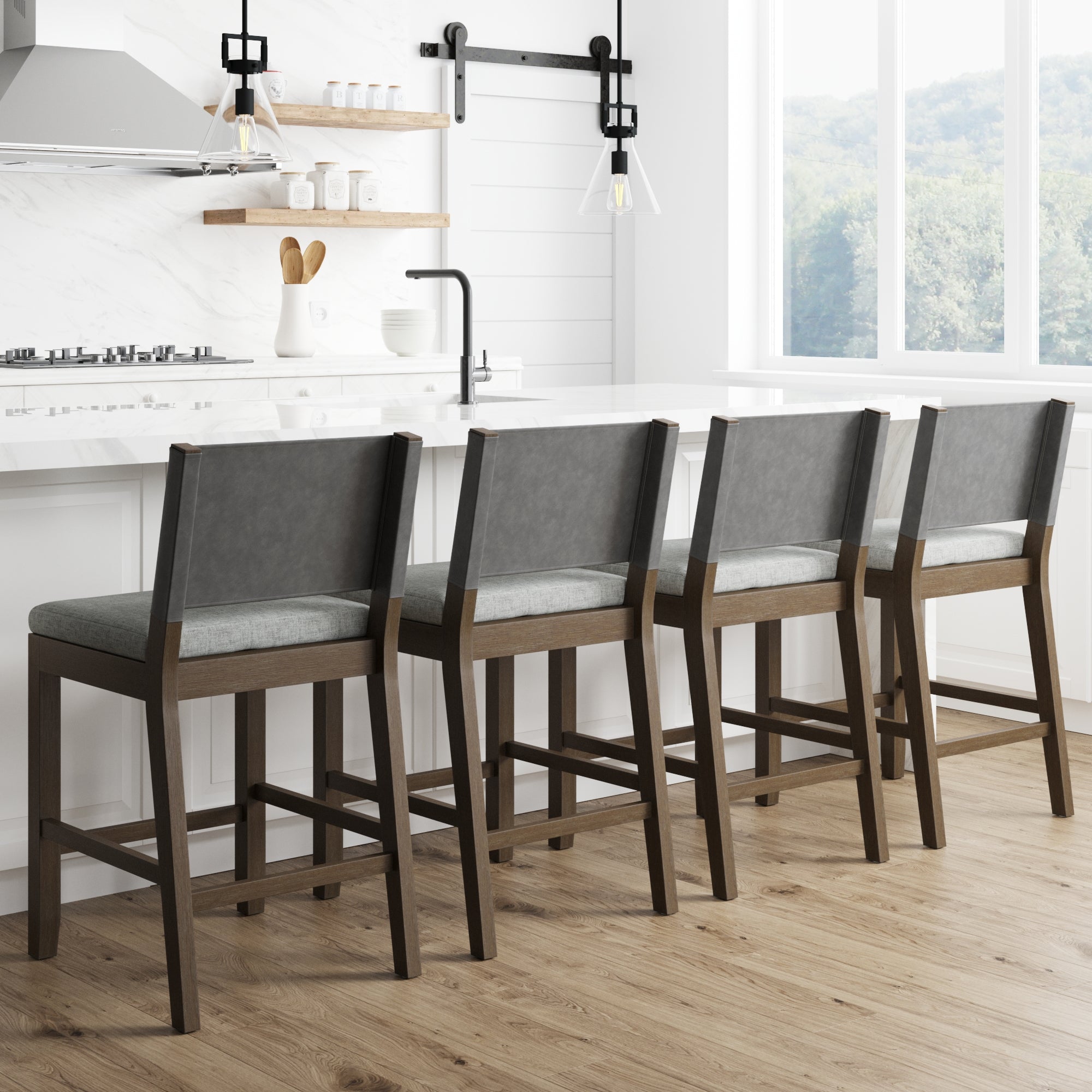 Four Nathan James Wood Counter Height Bar Stools in dark brown with ivory cushions are lined up at a white kitchen island in a bright, minimalist kitchen featuring large windows, wooden floors, and sleek decor. (Set of 4).