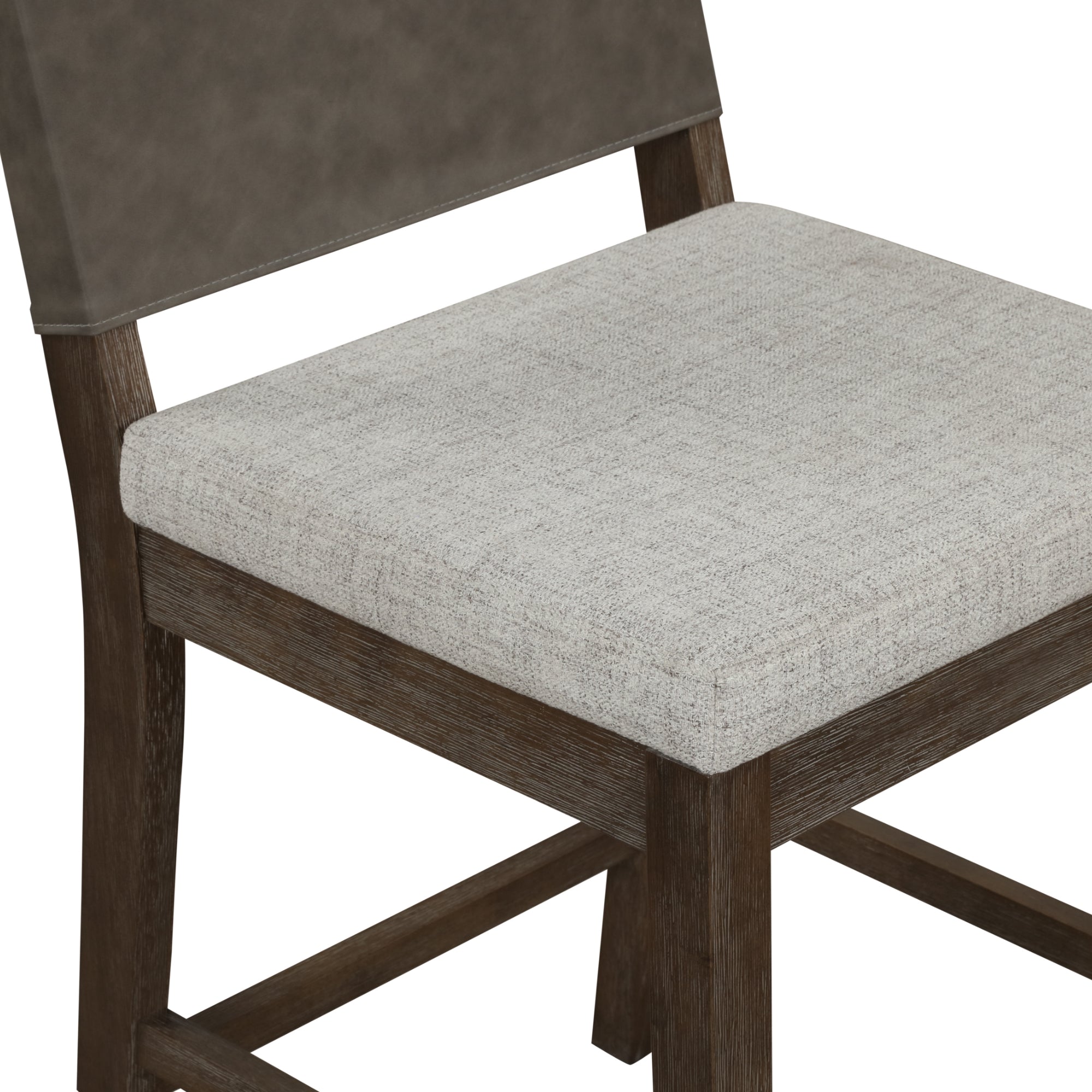 A close-up of a wooden chair with a light gray upholstered seat and a brown backrest, photographed against a white background.