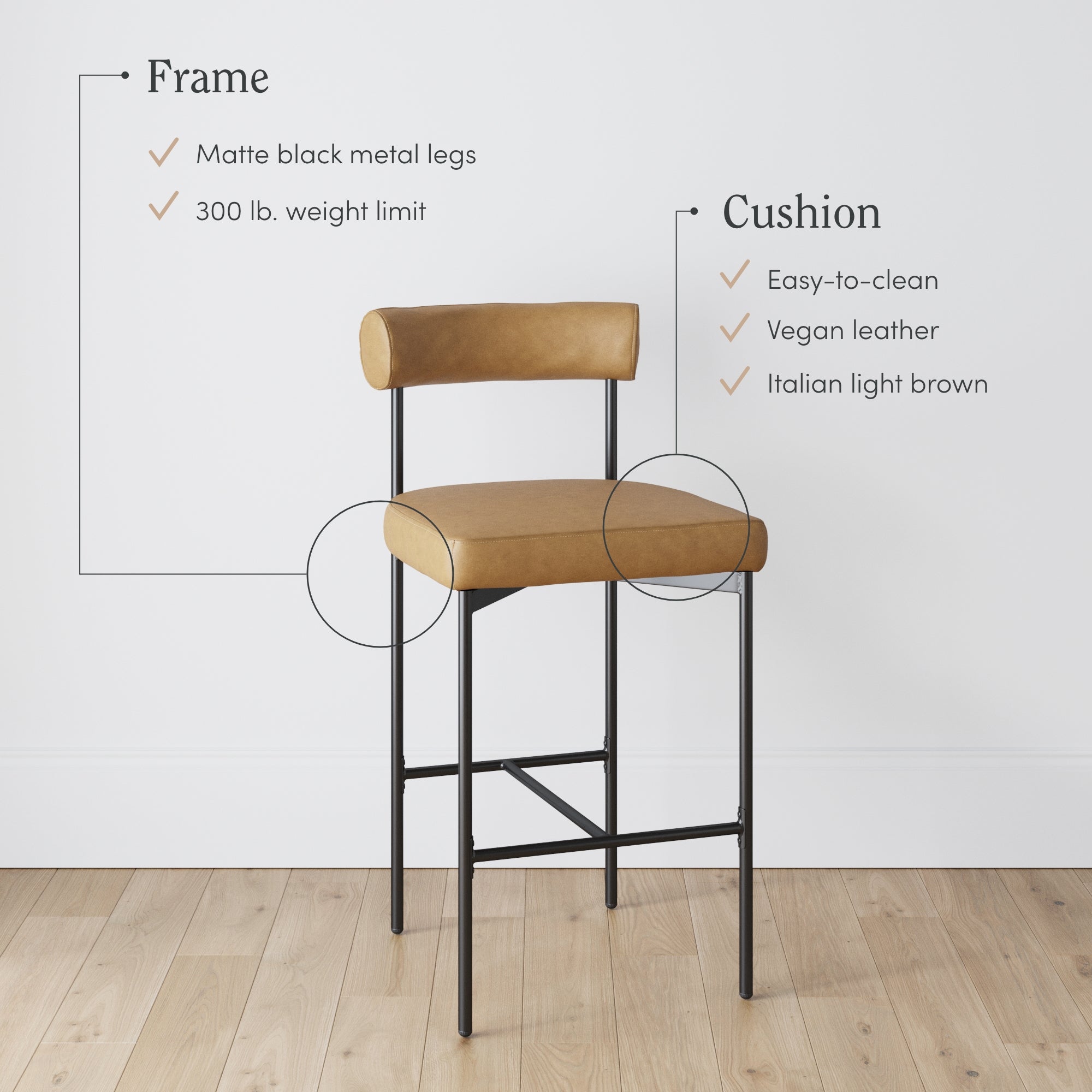 A modern bar stool with matte black metal legs and a light brown vegan leather cushion. Text highlights features: 300 lb. weight limit, easy-to-clean, vegan leather, Italian light brown cushion. Stool stands on wood floor.