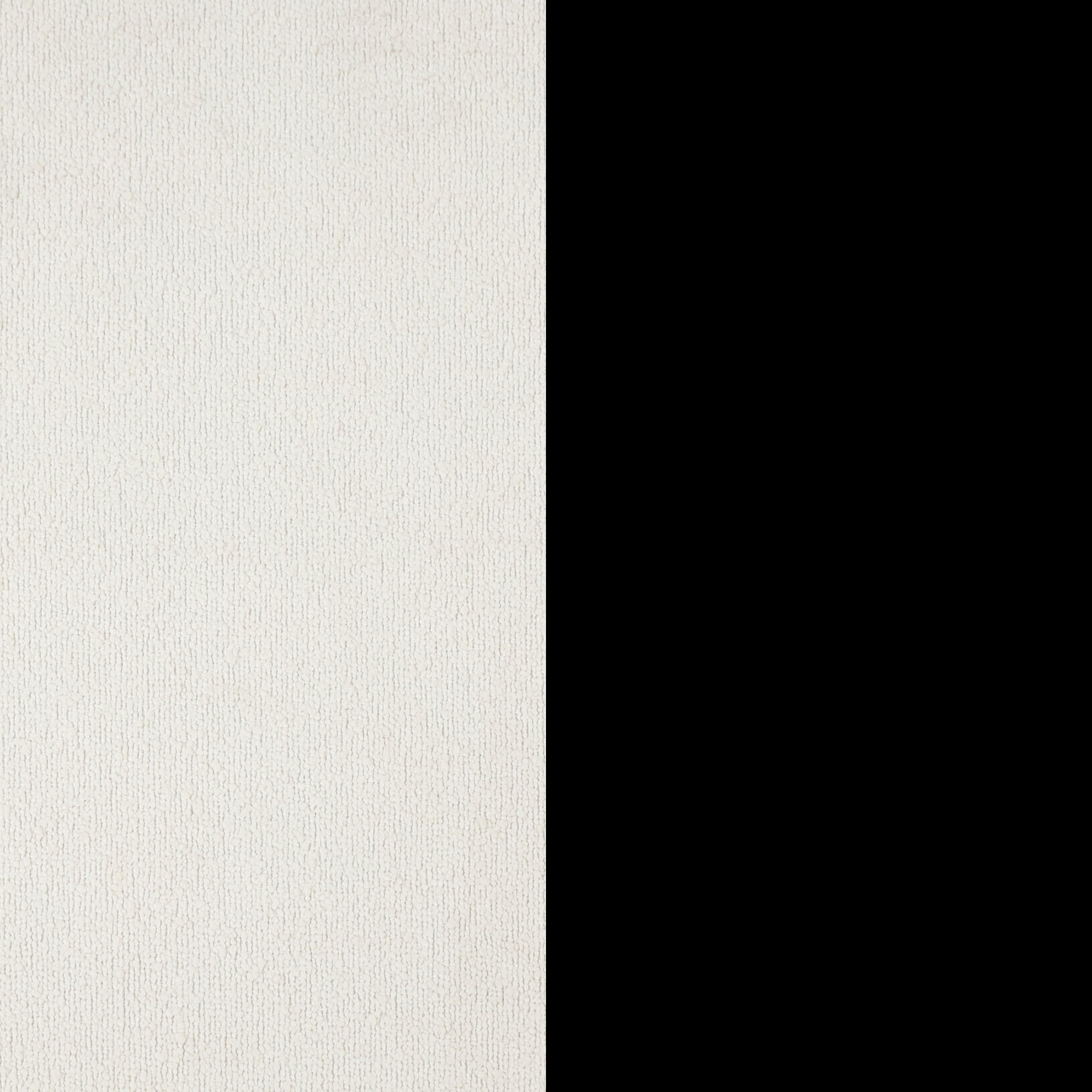 A vertical image with a textured white surface on the left side and a solid black section on the right. The dividing line between the two sections is straight and sharp.