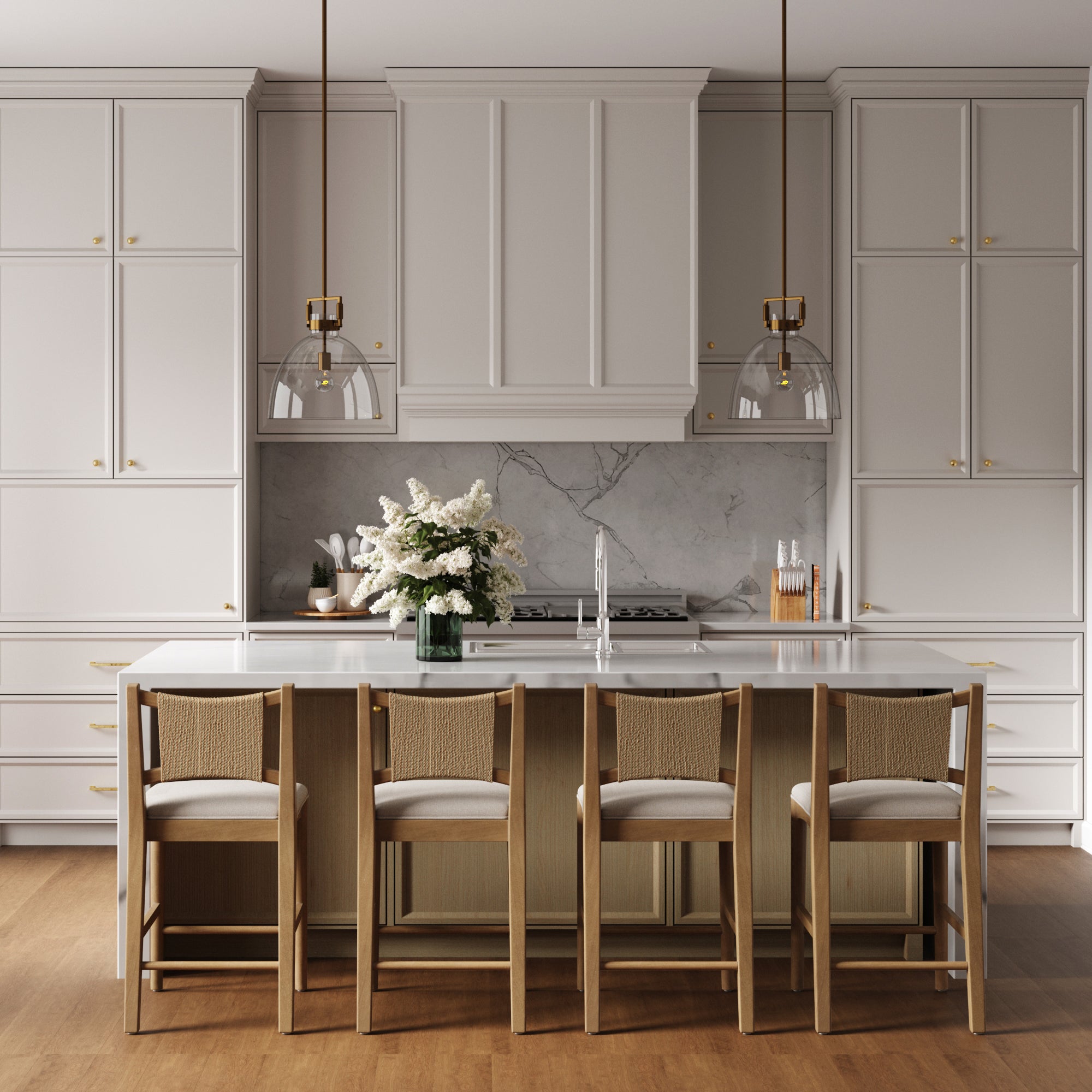 Modern kitchen with white cabinets, marble backsplash, and a large island featuring the Nathan James Seagrass Back Arched Footrest Counter Height Bar Stools (Set of 4). Two pendant lights hang above, and wooden flooring completes the look.
