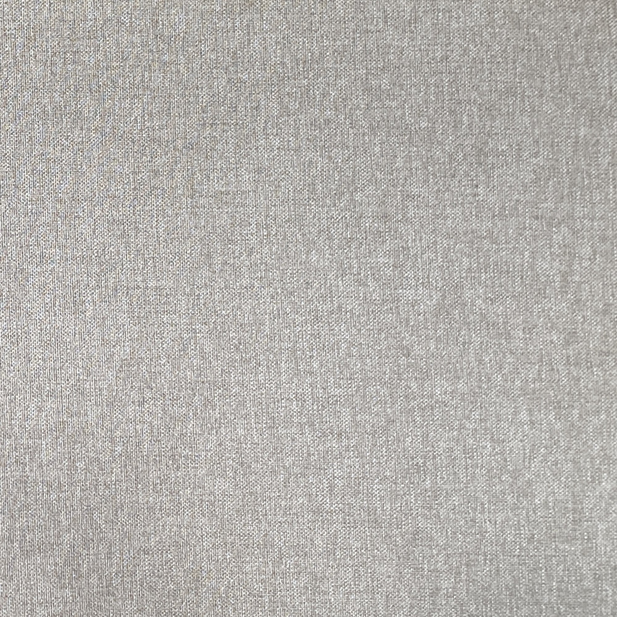 Close-up of a light grey fabric texture with a subtle, even weave pattern. The material appears smooth and uniform, with soft lighting enhancing its gentle, neutral tone.