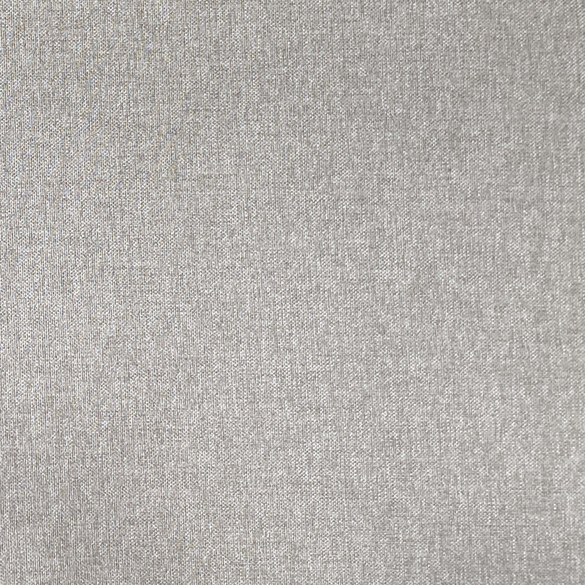 Close-up of a light gray fabric surface with a subtle, fine woven texture and even coloration.