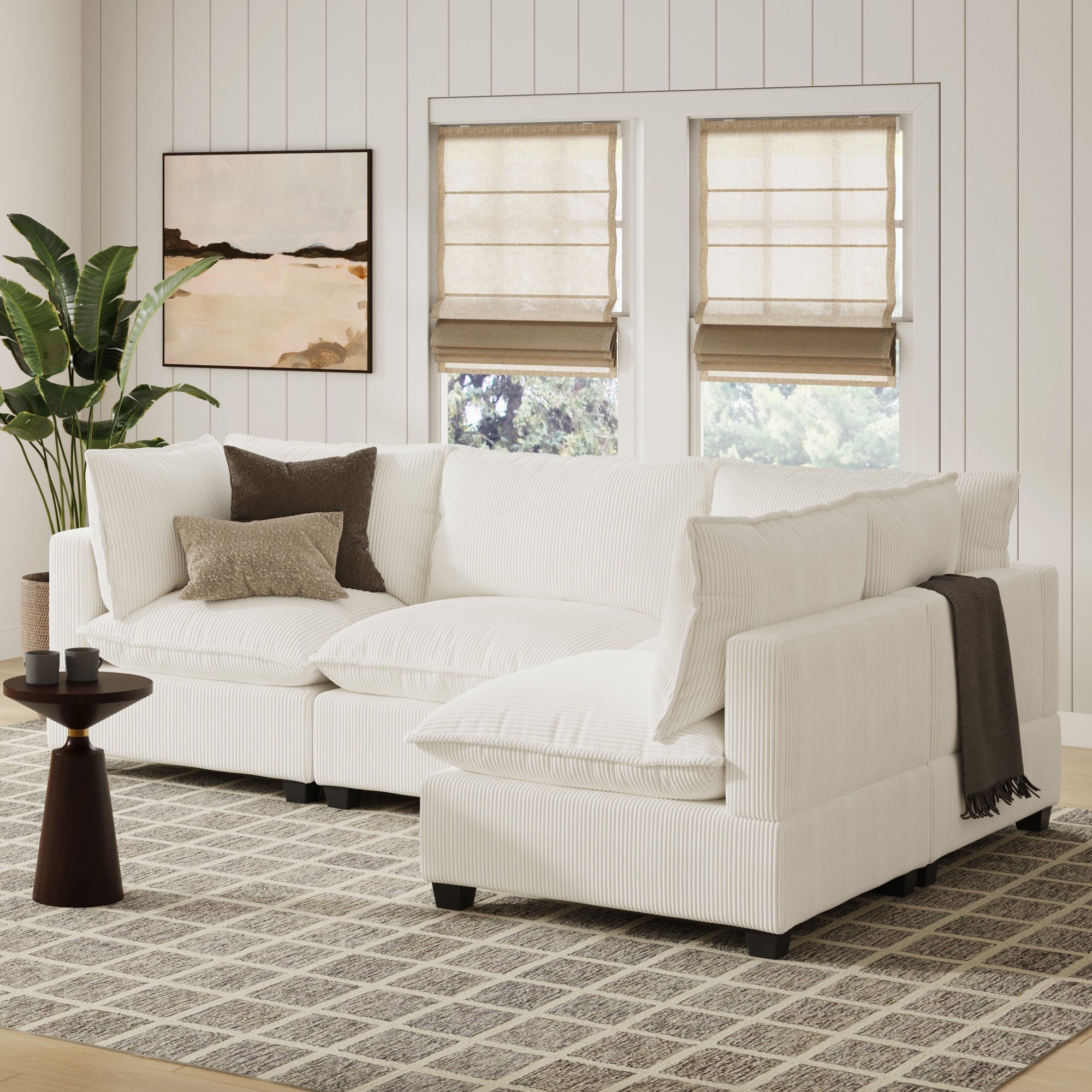 The Nathan James Corduroy 4-Seat Cloud Armless Sectional Sofa Couch in Pearl White enhances the room with cozy comfort and modern style.