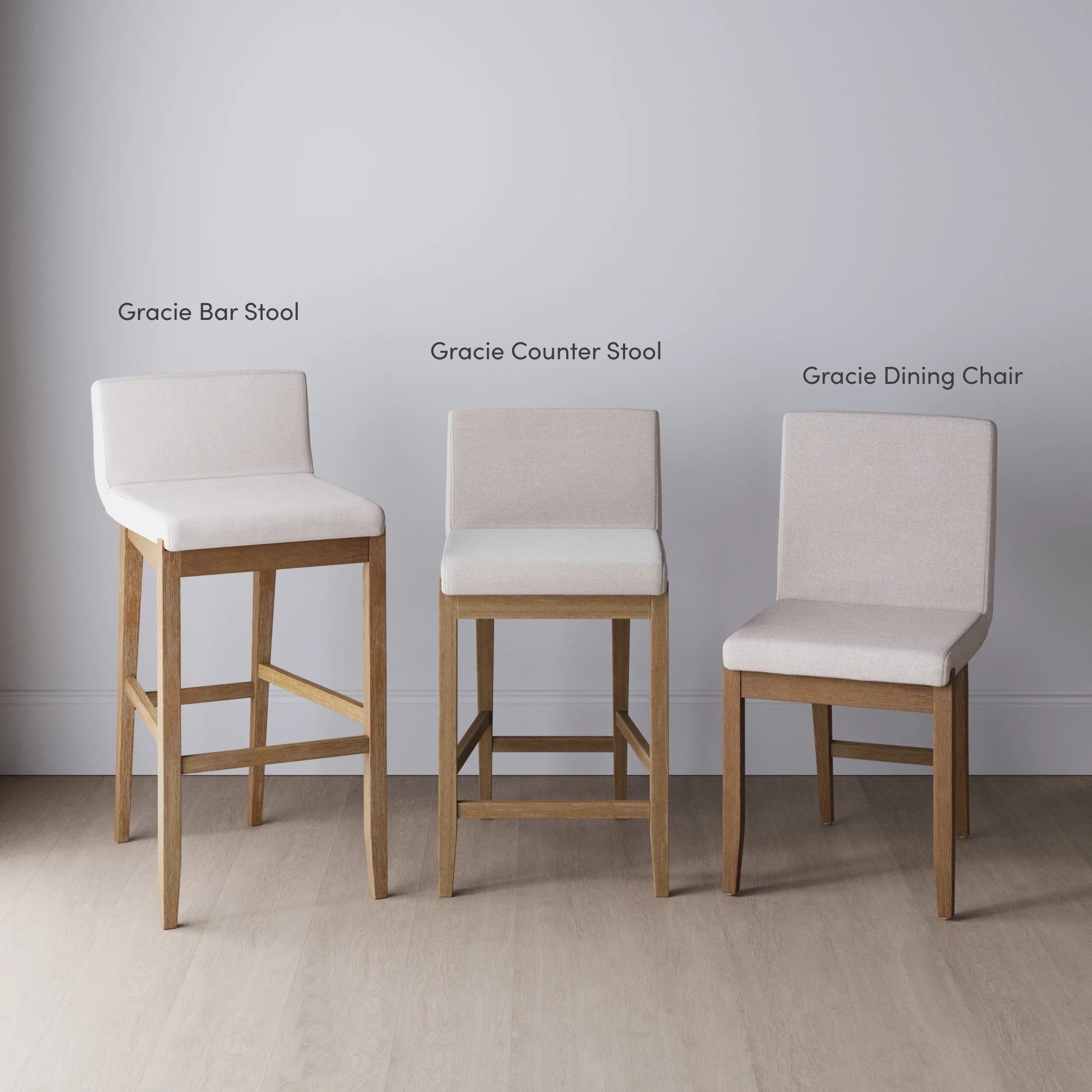 Three upholstered chairs are shown side by side: a tall bar stool, a slightly shorter counter stool, and a standard-height dining chair, all with light wood legs and labeled above each chair.