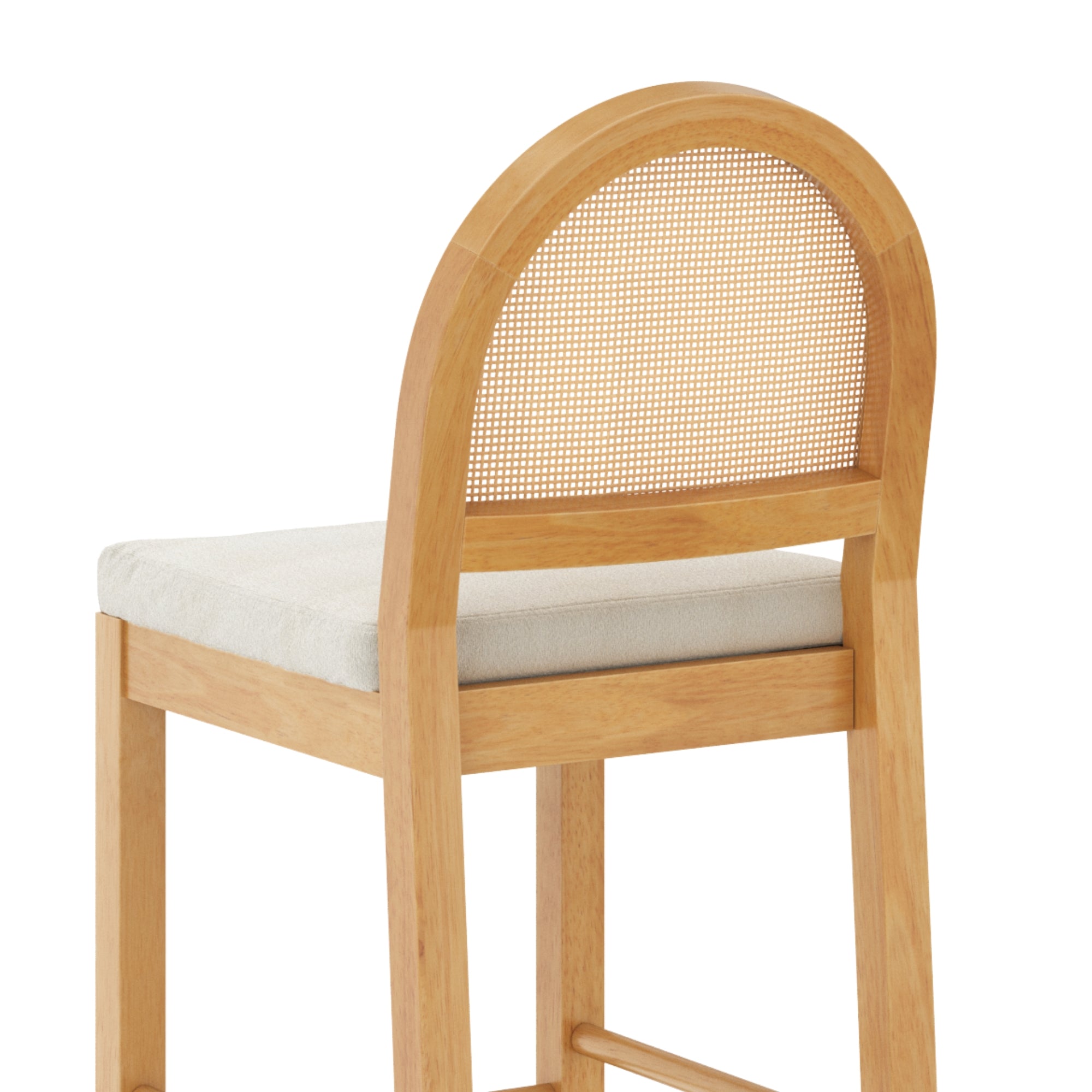 A wooden bar stool with a light beige cushioned seat and a curved backrest featuring a woven cane panel. The stool has straight legs and a simple, modern design.