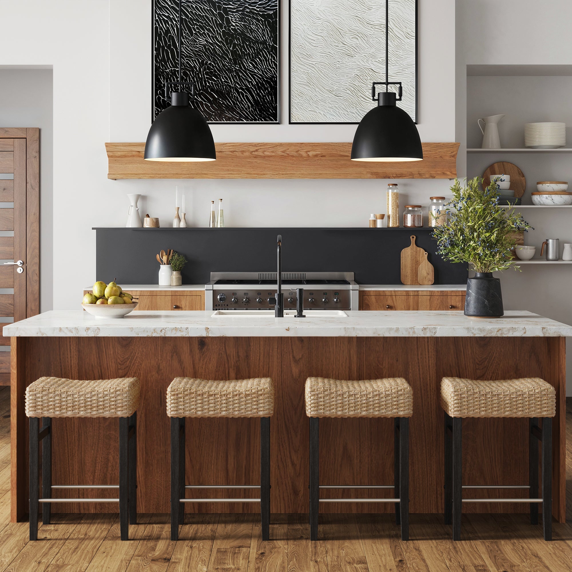 Modern kitchen with a large island, Nathan James Seagrass Counter Height Bar Stools in black at the counter, black pendant lights, wood accents, white marble countertop, open shelves with dishes, and minimalist black-and-white artwork above the stove.