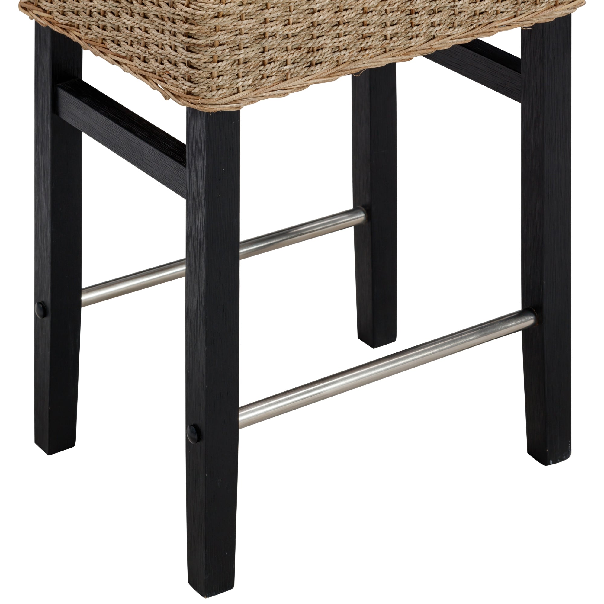 Close-up of the lower part of a stool with black wooden legs, two metal footrests, and a woven wicker seat.