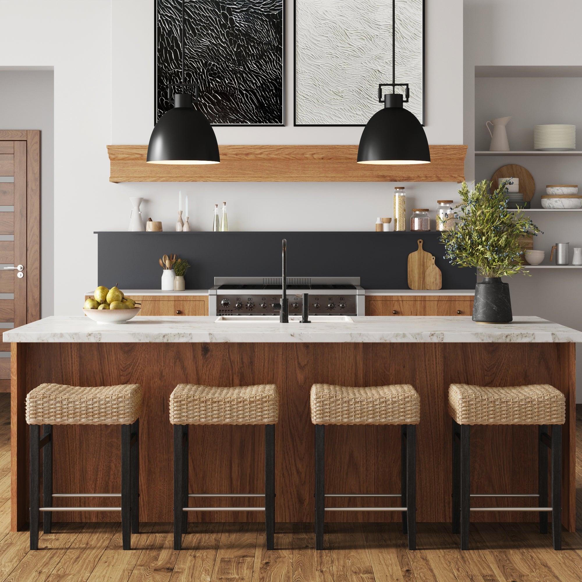 Modern kitchen with a wooden island, four Nathan James Woven Seagrass Counter Height Bar Stools in black, black pendant lights, marble countertop, plants, shelves with dishes, and abstract art above a wooden shelf.