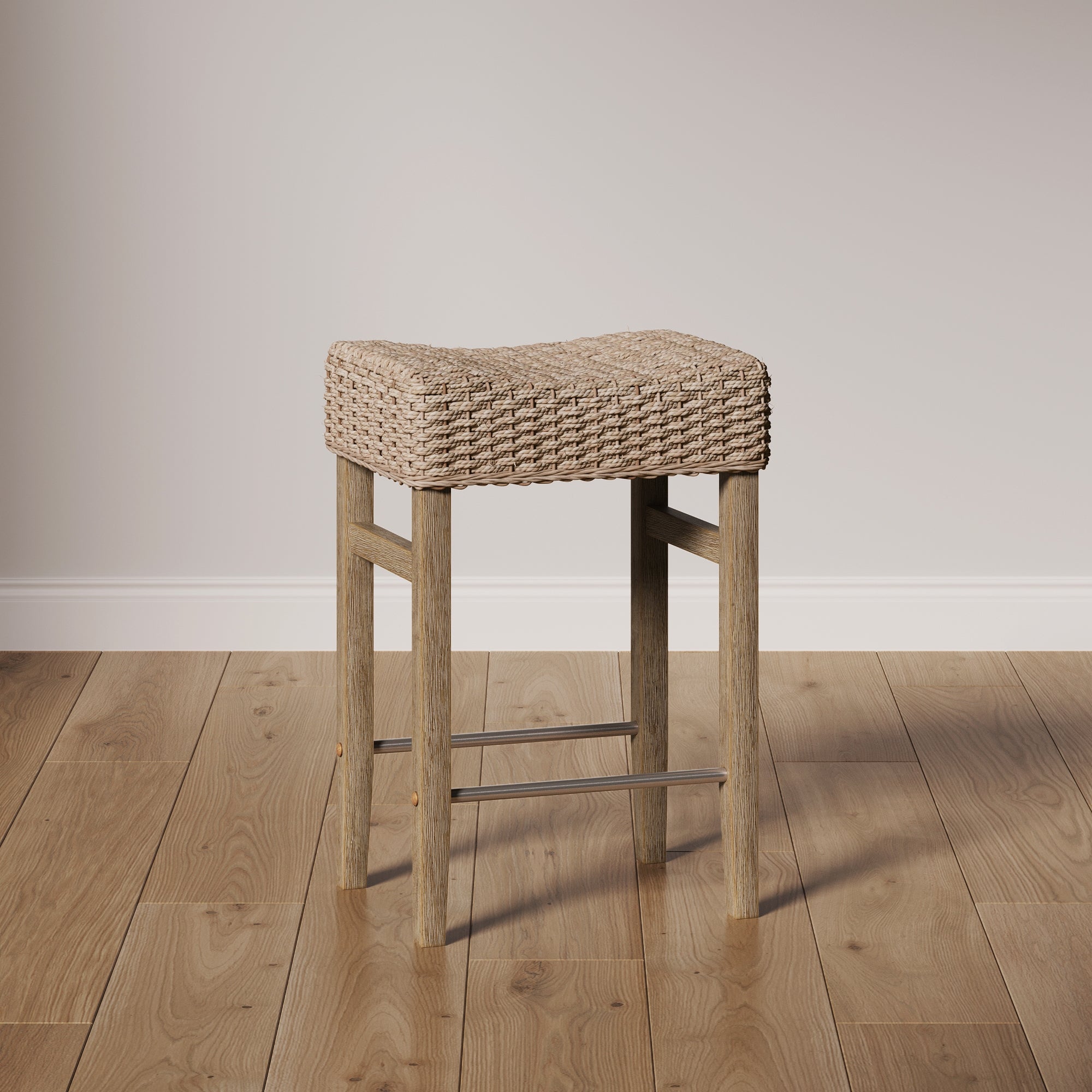 The Nathan James Woven Seagrass Counter Height Bar Stool in Brown features a woven seagrass seat and wooden legs, perfect for light wood floors and plain, light-colored walls.
