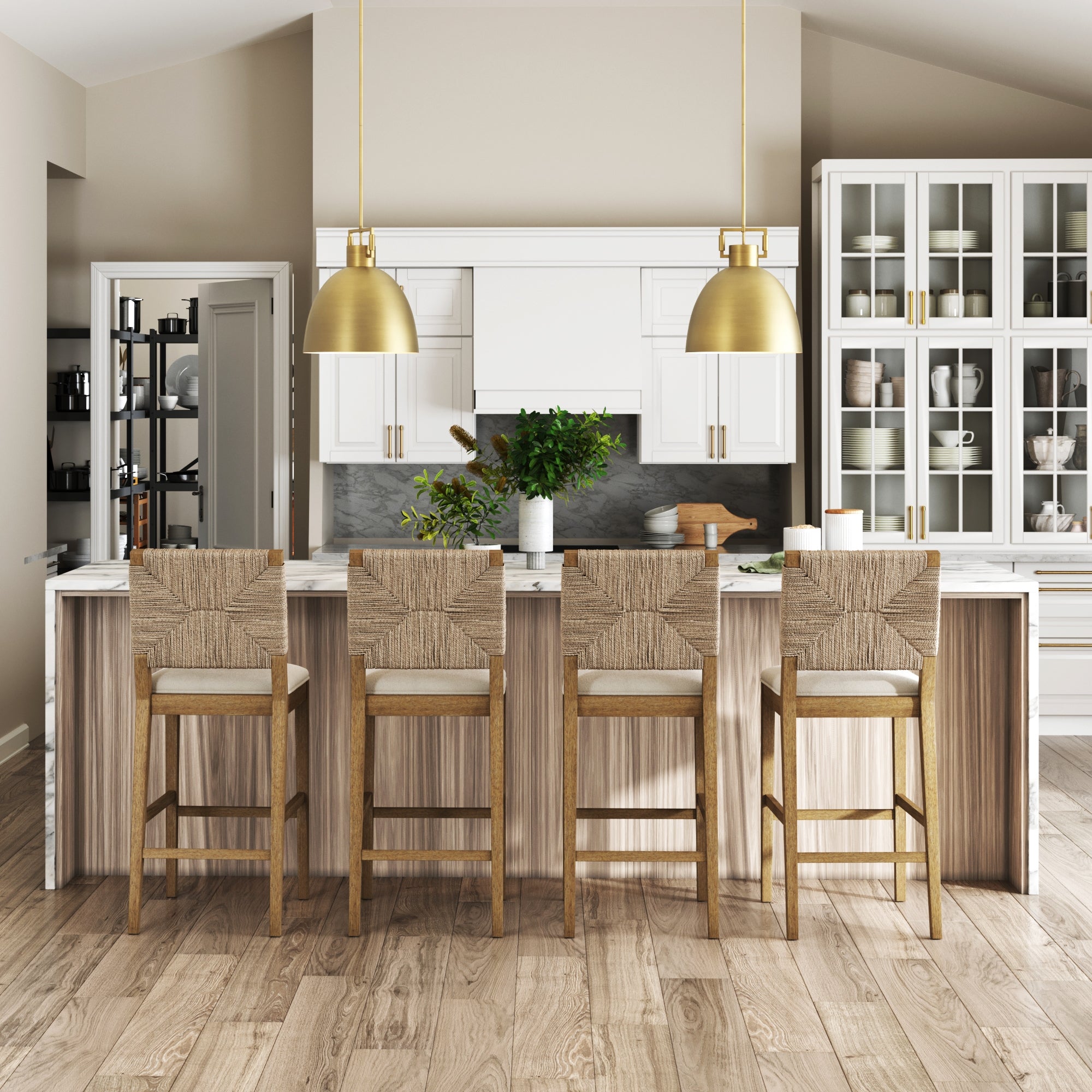 Modern kitchen with a large island, four Nathan James Boucle & Seagrass Bar Stools in light brown, white cabinets, gold pendant lights, a glass-fronted cabinet, and neutral décor. Marble countertop displays greenery and kitchenware.