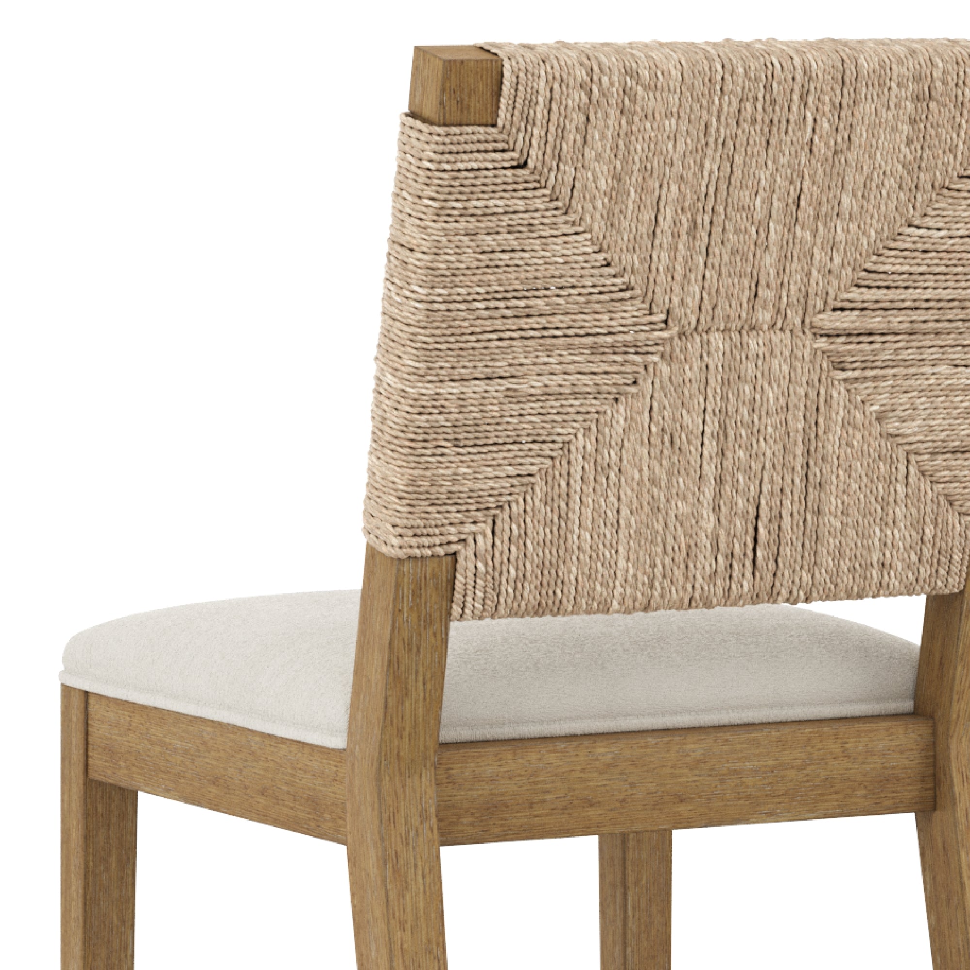 A close-up of a wooden chair with a natural woven rope backrest and a light-colored cushioned seat. The rope is arranged in a geometric pattern.