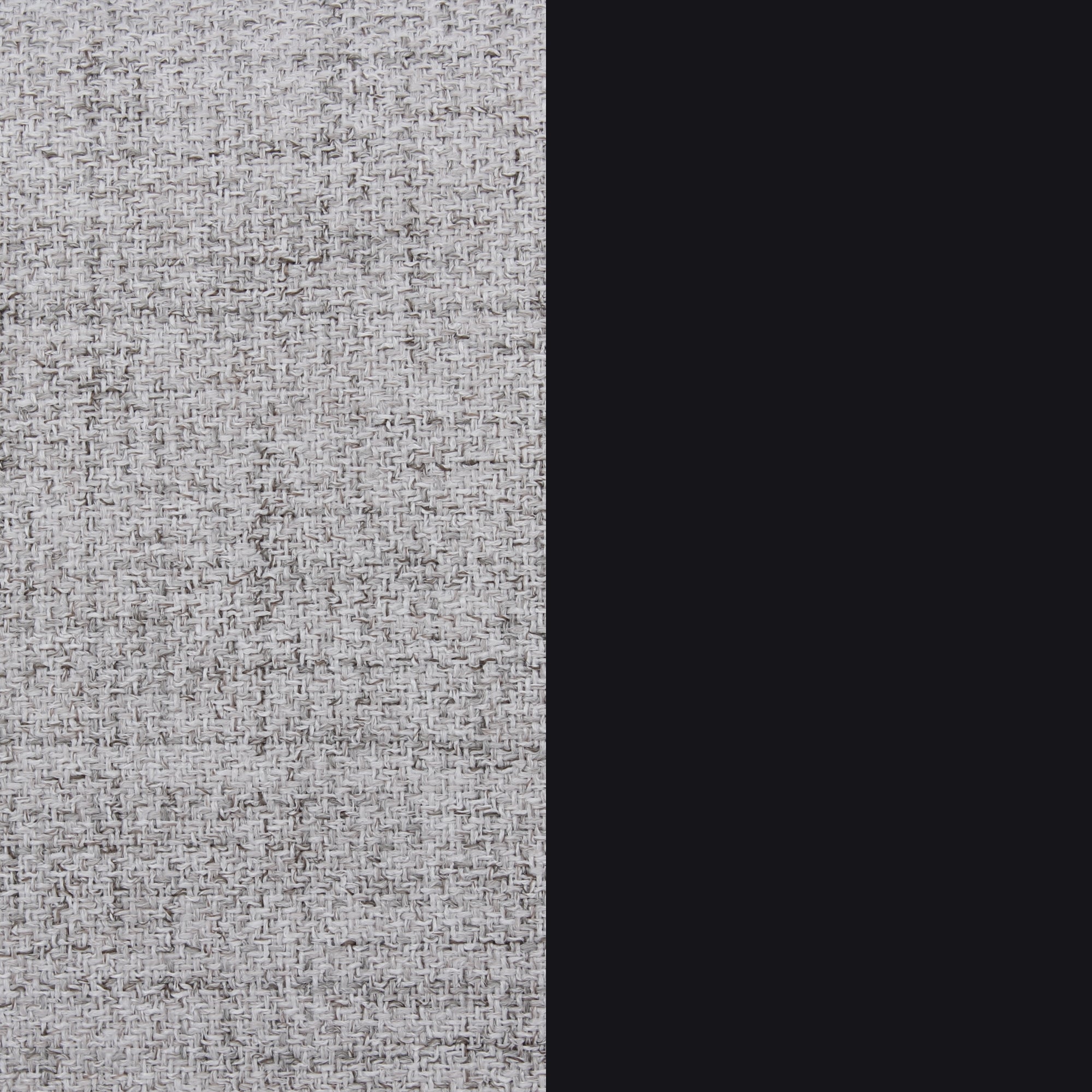 A close-up of a light gray woven fabric texture on the left side, next to a solid black vertical strip on the right.