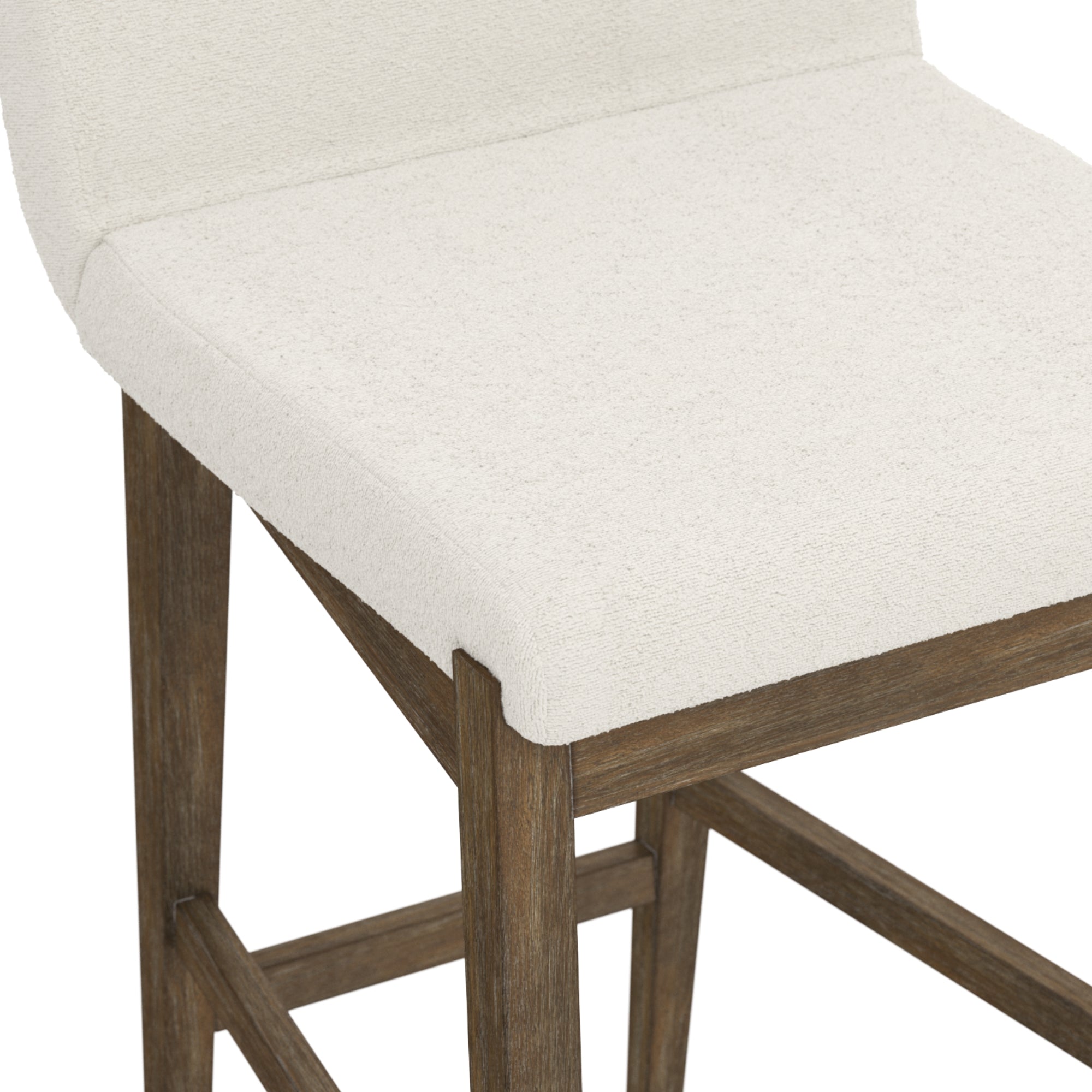 A close-up of a barstool with a light beige upholstered seat and backrest, featuring wooden legs and footrests in a natural wood finish.