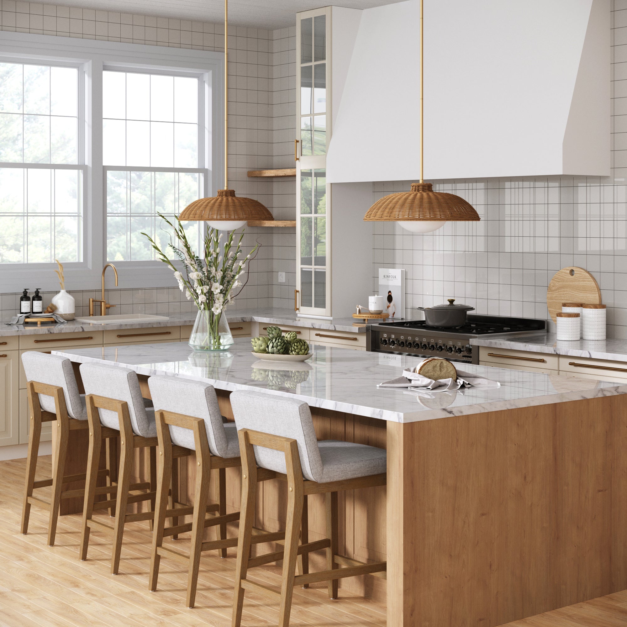 A modern kitchen features a large marble island with Nathan James Upholstered Counter Height Bar Stools (Gray, set of 4), pendant lights, light wood flooring, white cabinets, expansive windows streaming natural light, and a vase with flowers on the island.