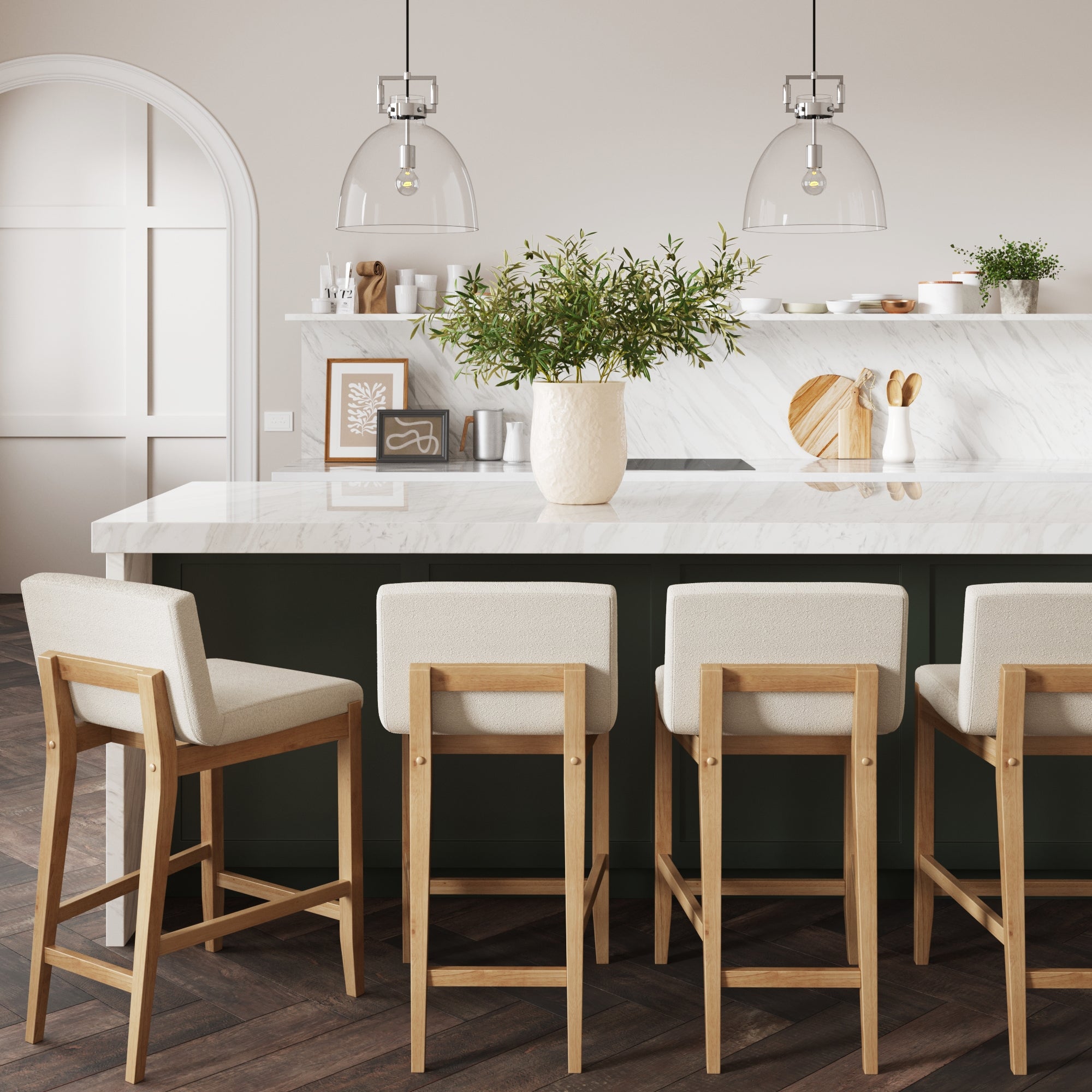 A modern kitchen with four wooden barstools, a marble island, a vase with greenery, minimalist decor, and pendant lights hanging above the counter. Light wood floors and neutral tones create a cozy, elegant atmosphere.