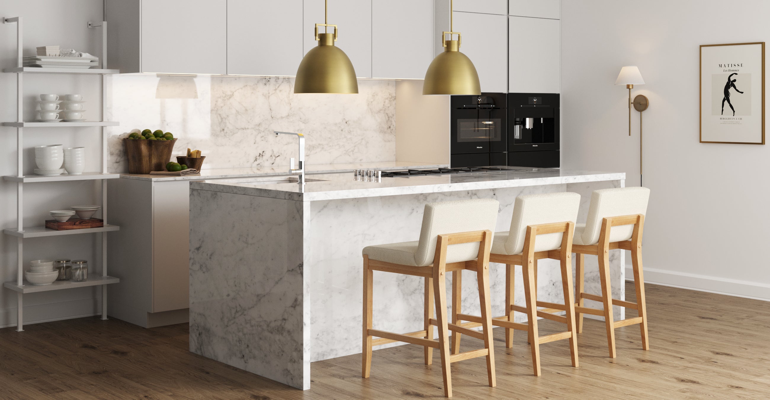 Modern kitchen with a marble island, three wooden stools with white cushions, pendant lights above, built-in black appliances, white cabinets, and a wall with a framed art print and a sconce.