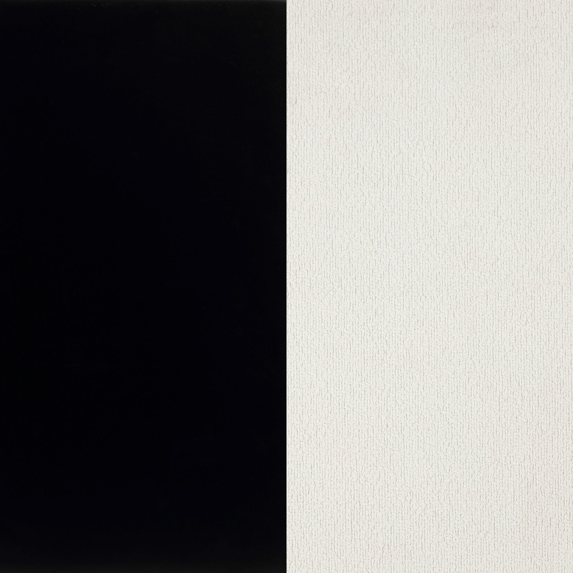 A rectangular image split vertically down the middle, with the left half solid black and the right half solid white with a slightly textured surface.