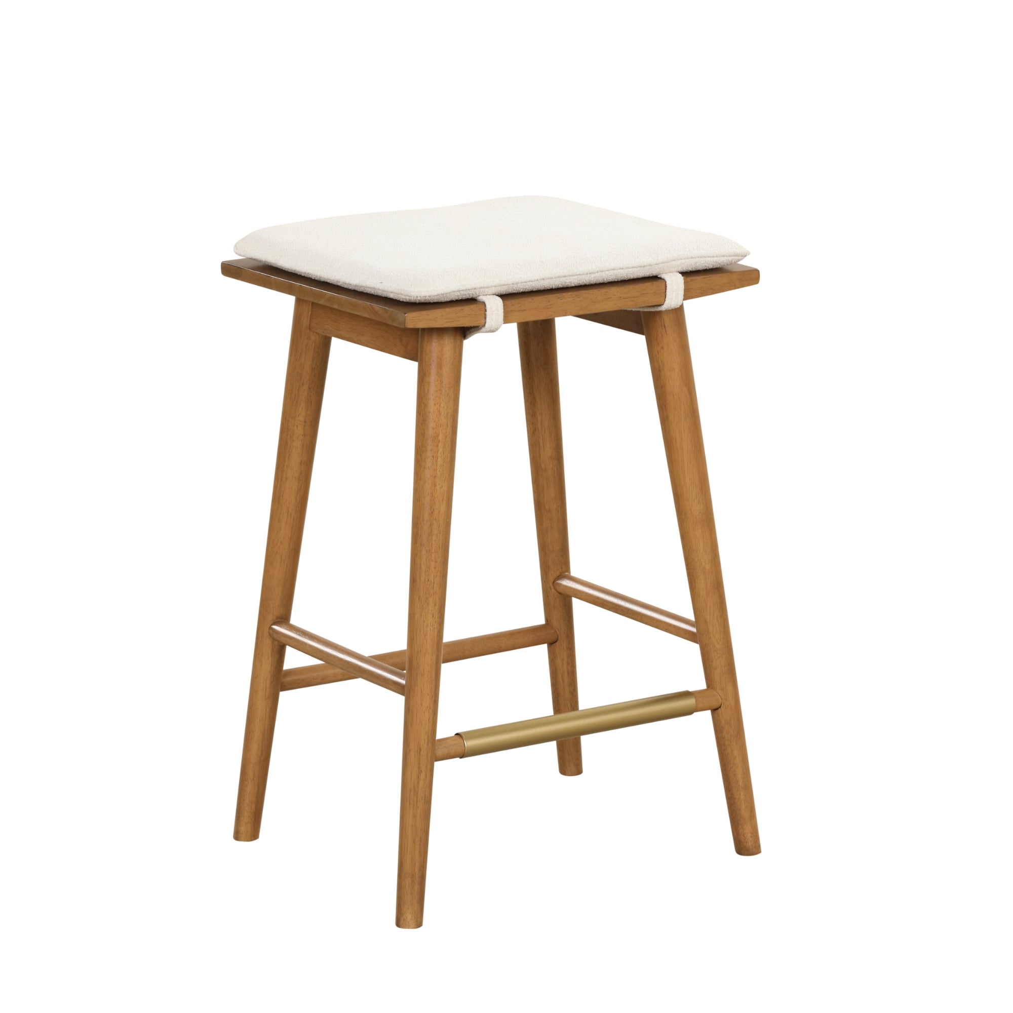 A wooden stool with four angled legs, a brass footrest, and a rectangular seat featuring a cushioned white pad secured by fabric straps.