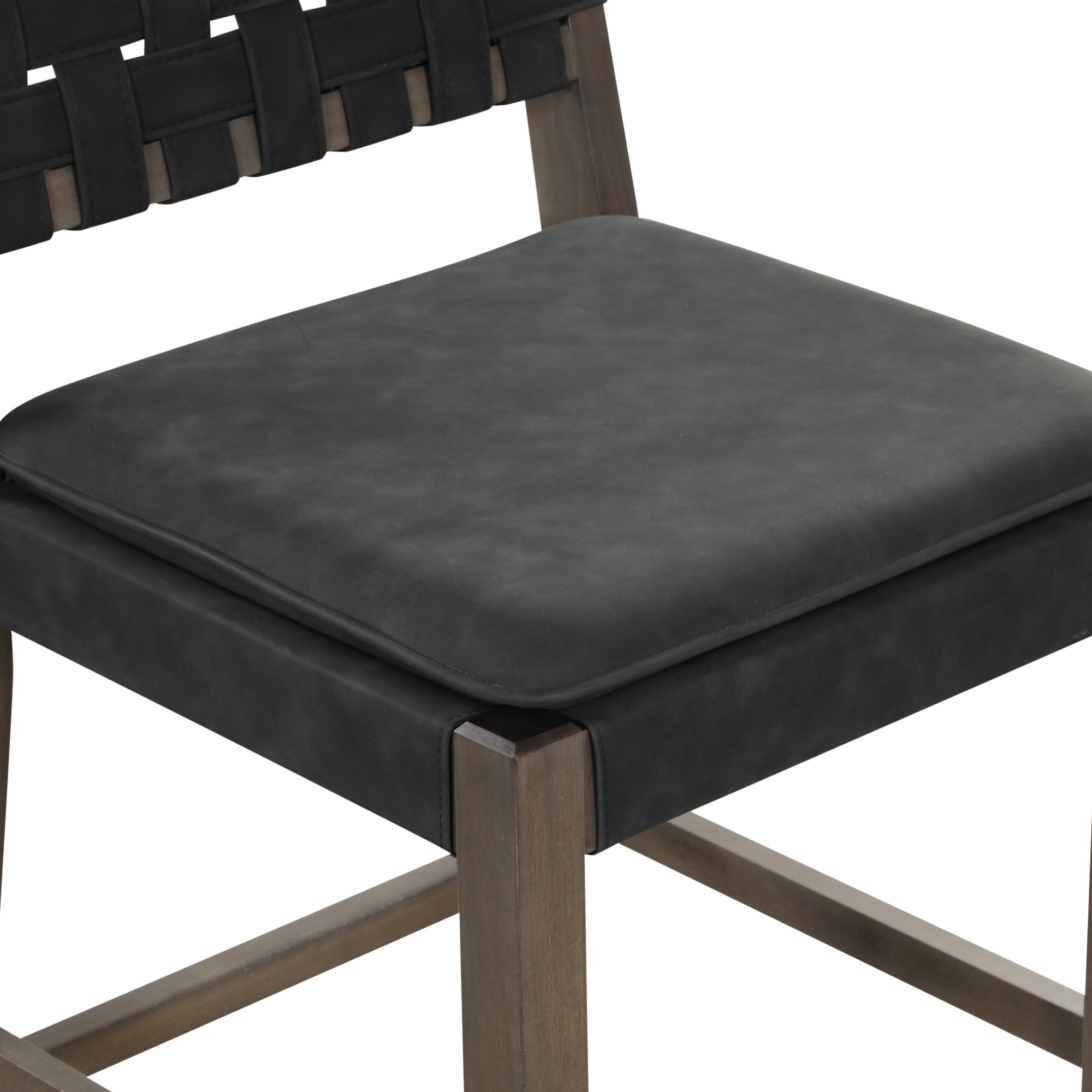 A close-up of a modern chair with a black cushioned seat, black woven backrest, and wooden frame. The design features clean lines and a minimalist style.
