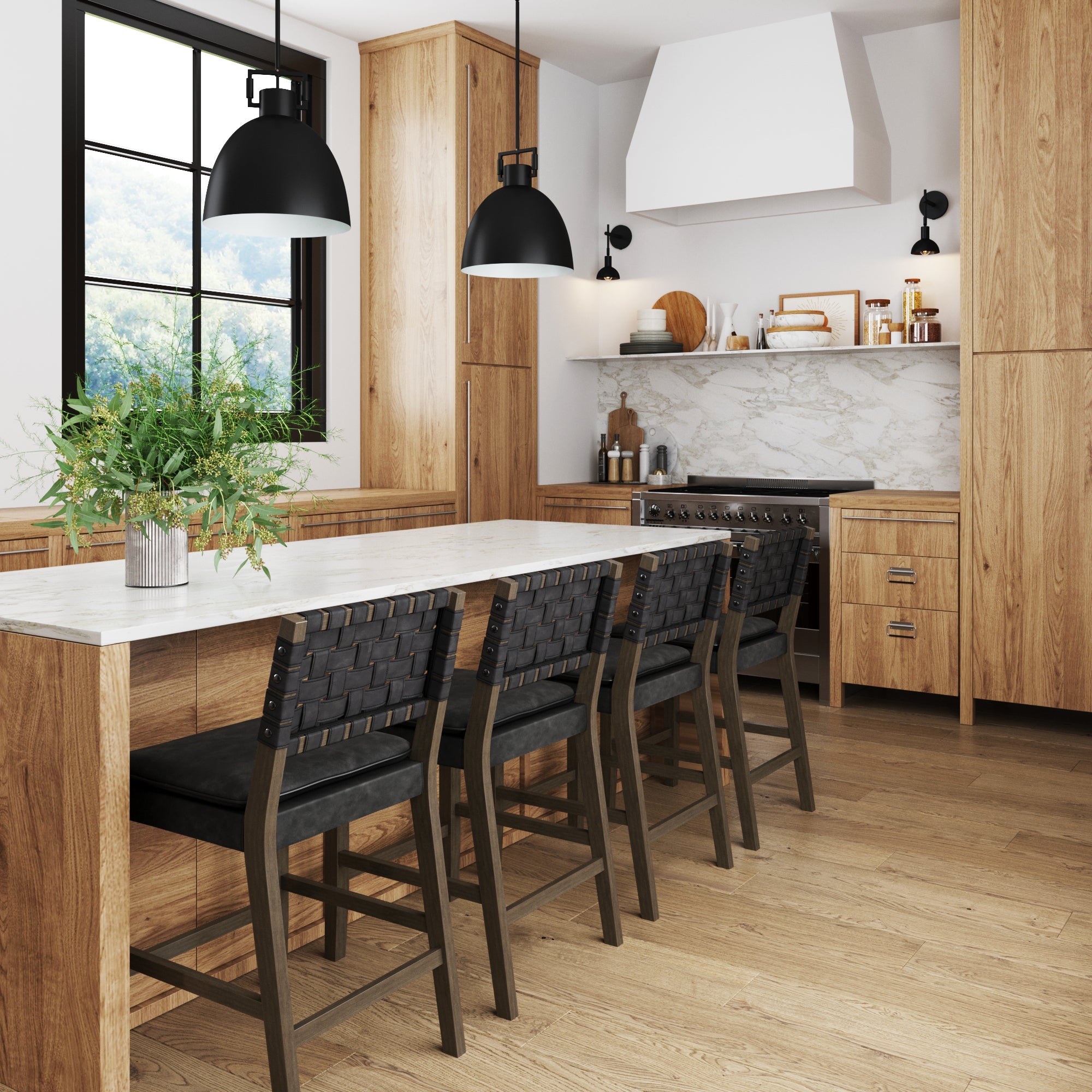 Modern kitchen with light wood cabinets, a marble backsplash, black pendant lights, and a white island countertop. Four black woven chairs are arranged at the island, and a vase with greenery is placed on top.