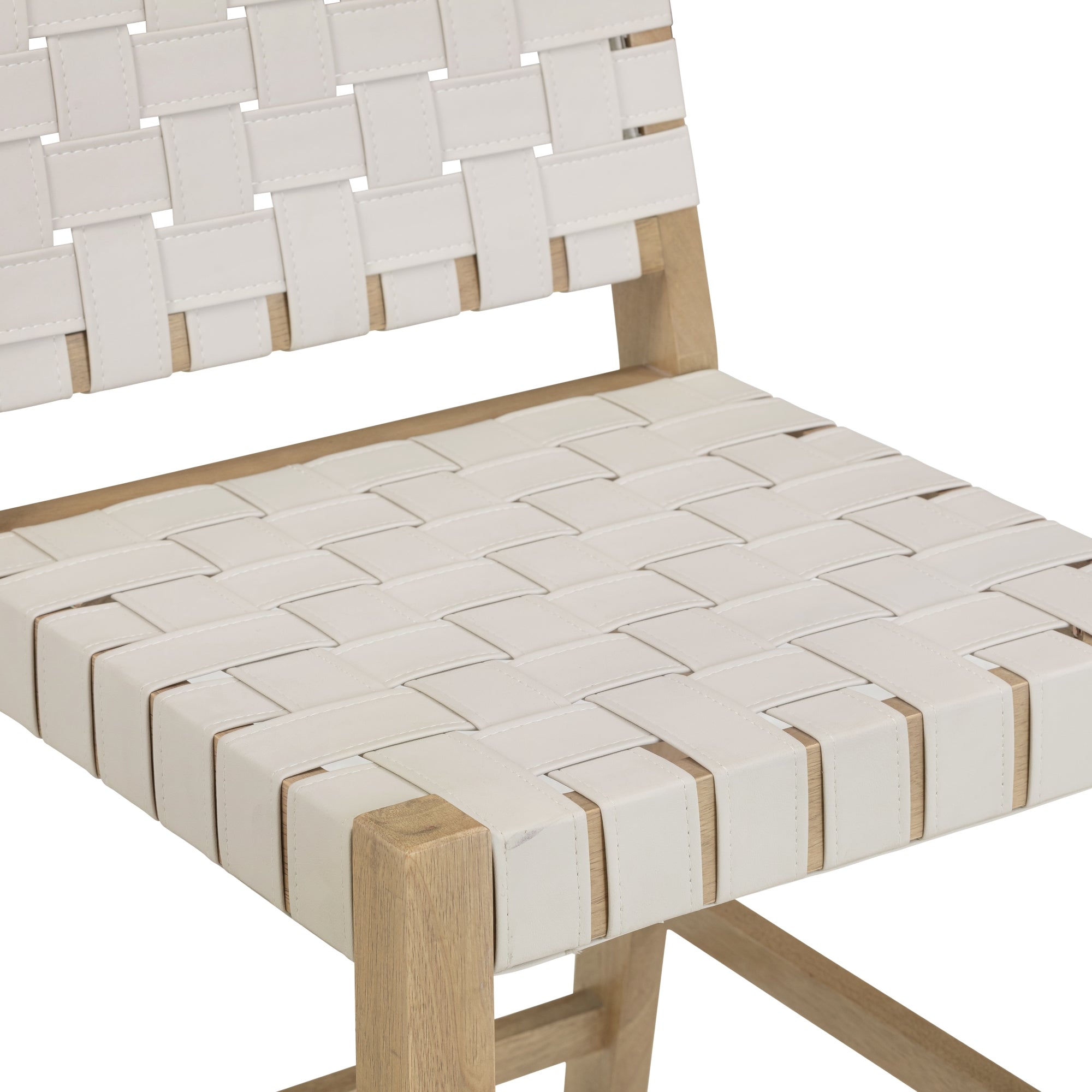 A close-up of a chair with a wooden frame and a seat and backrest made of white woven straps in a basket-weave pattern.