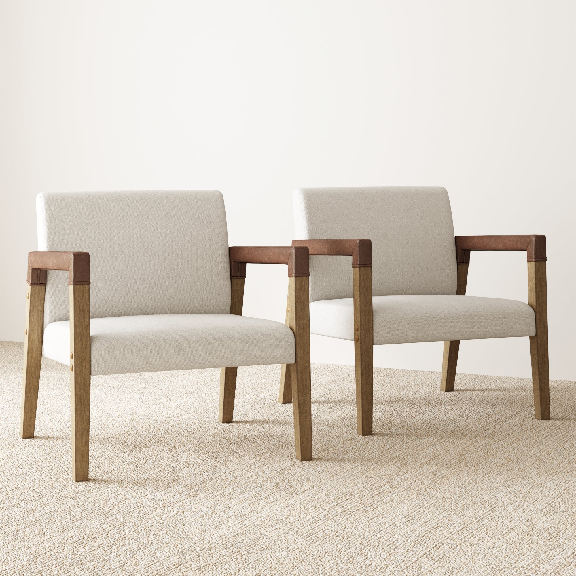 Two Nathan James Wood & Faux Leather Accent Chairs (Set of 2) are placed side by side on a light textured carpet against a plain, light-colored wall, creating a stylish and modern living room chair set.
