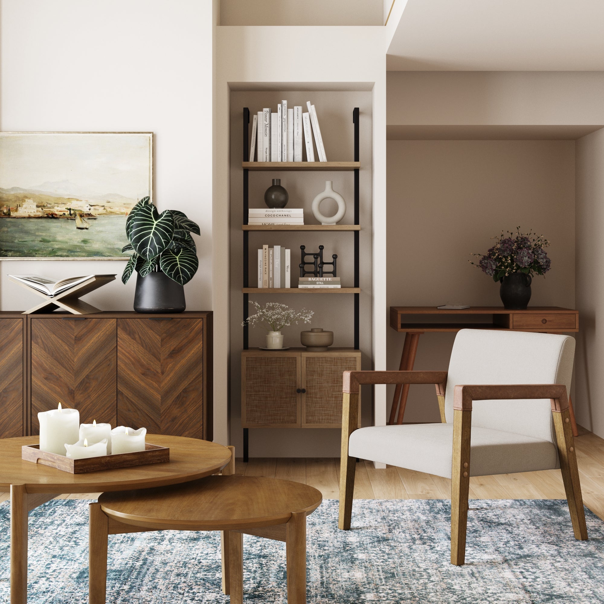 A modern living room with a wooden armchair, nested coffee tables with candles, a blue rug, a cabinet with a plant and art, a bookshelf, and a small desk with flowers in the corner. Natural light fills the space.