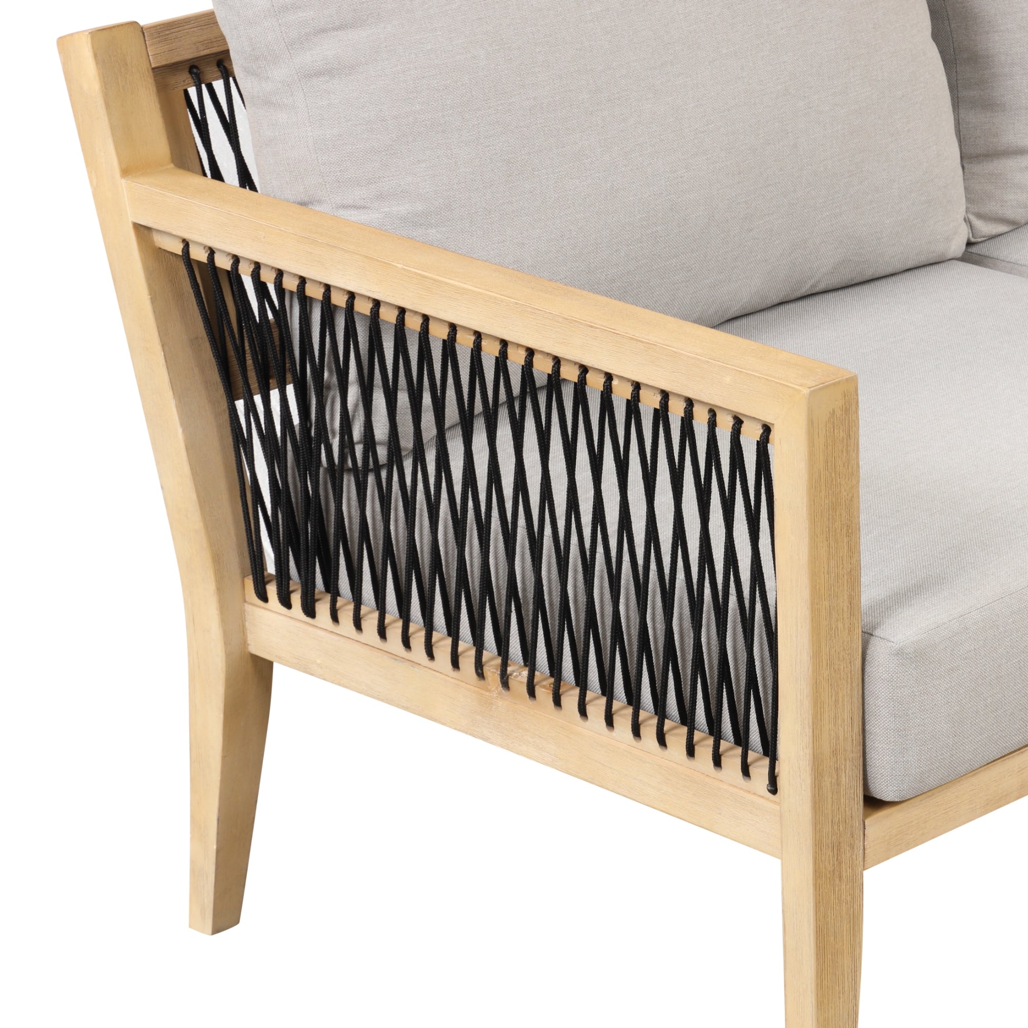 A close-up of a wooden chair with light beige cushions and black crisscrossed rope detailing along the side.