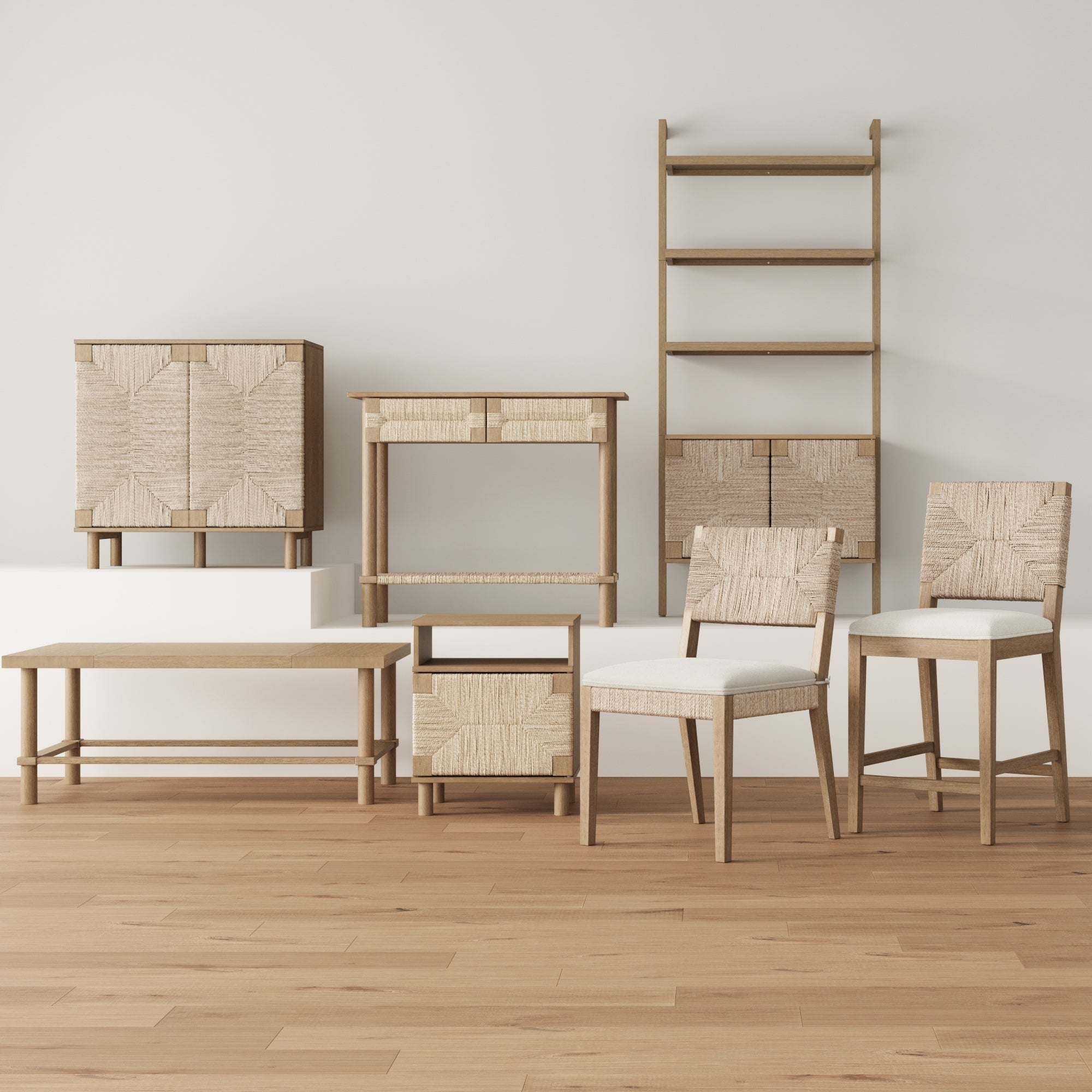A set of light wood furniture, including two chairs, a bench, cabinets, a shelving unit, and a console table, is arranged against a white wall on a wooden floor. The design features woven textures and clean lines.