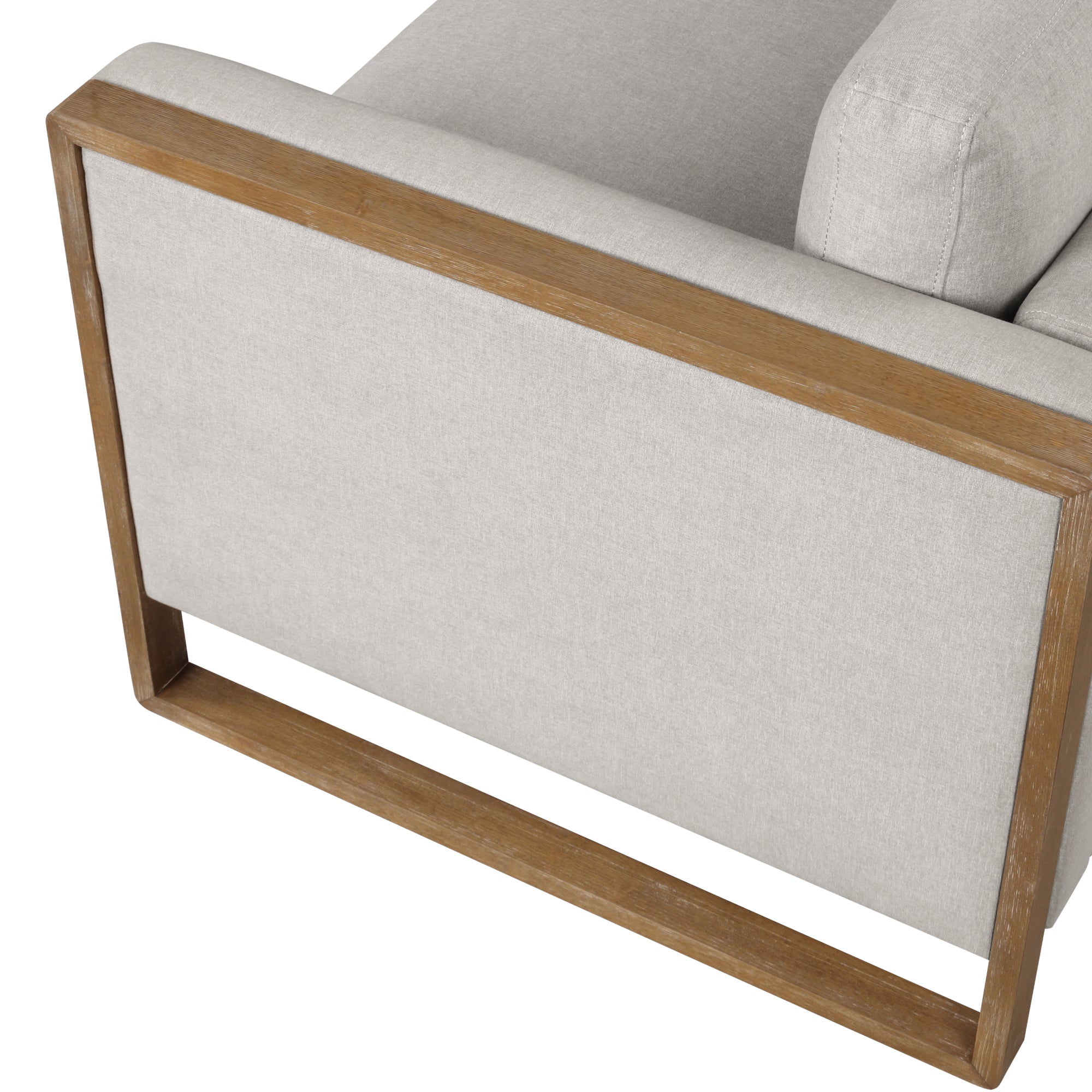 A close-up of the back of a modern armchair with light beige upholstery and a rectangular wooden frame. The design features clean lines and a minimalist style.