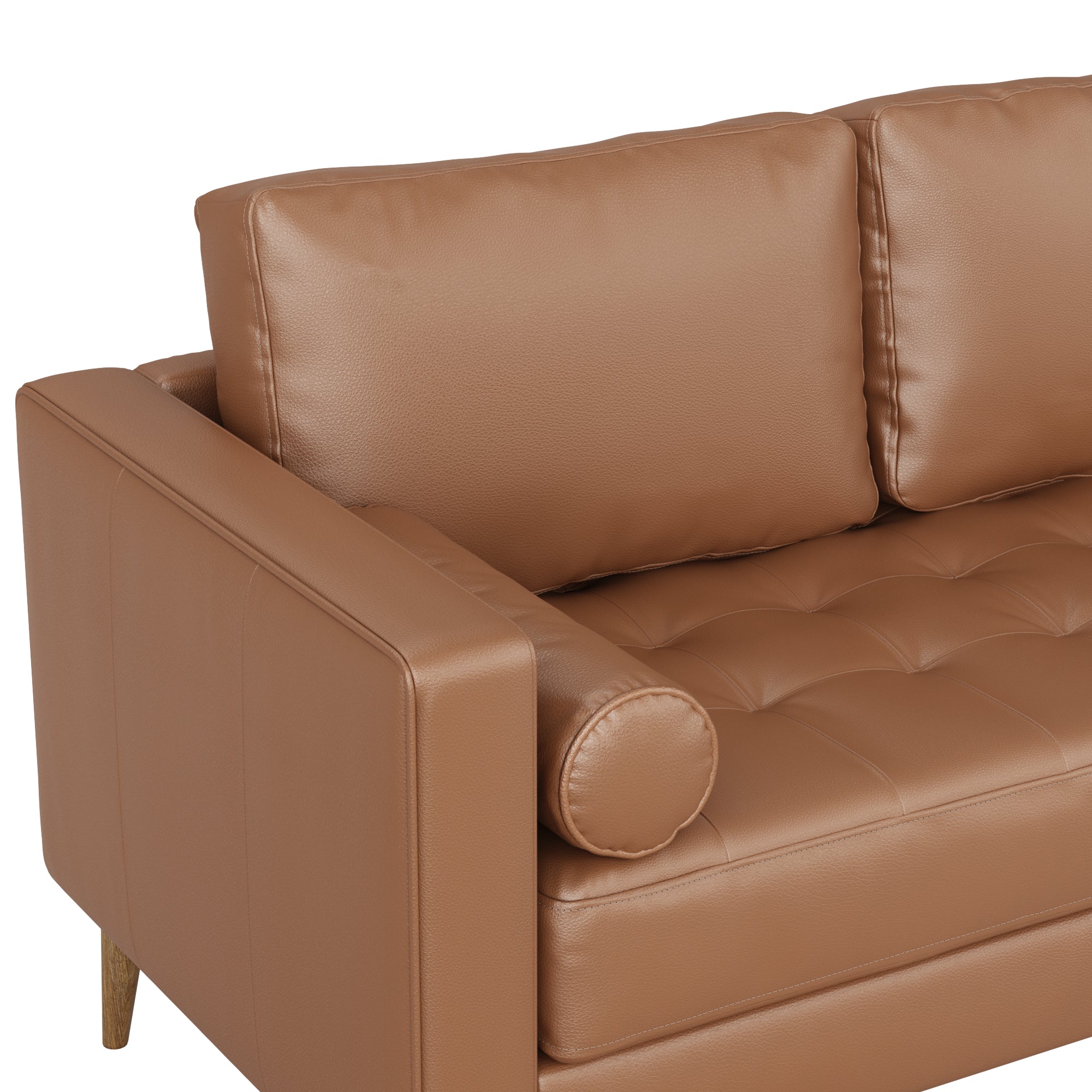 Close-up view of a modern brown leather sofa with tufted seat cushions, two rectangular back cushions, a cylindrical bolster pillow, and wooden legs.