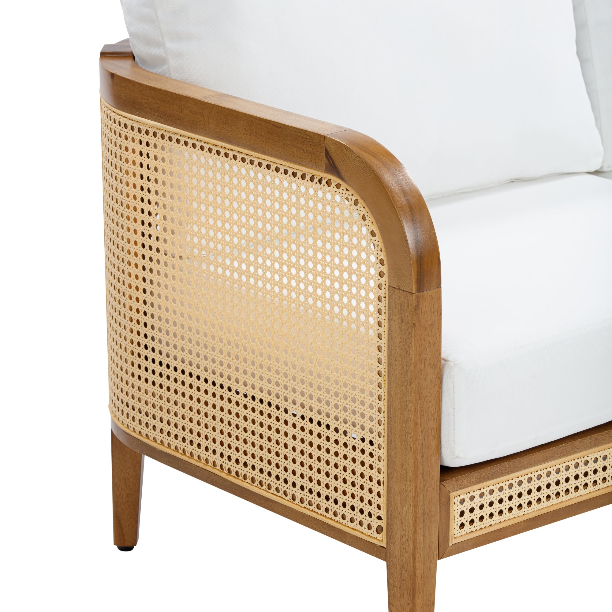 A close-up of a wooden chair featuring woven cane side panels and white seat and back cushions. The wood has a smooth, light finish, and the cane work adds a natural, airy detail to the modern design.