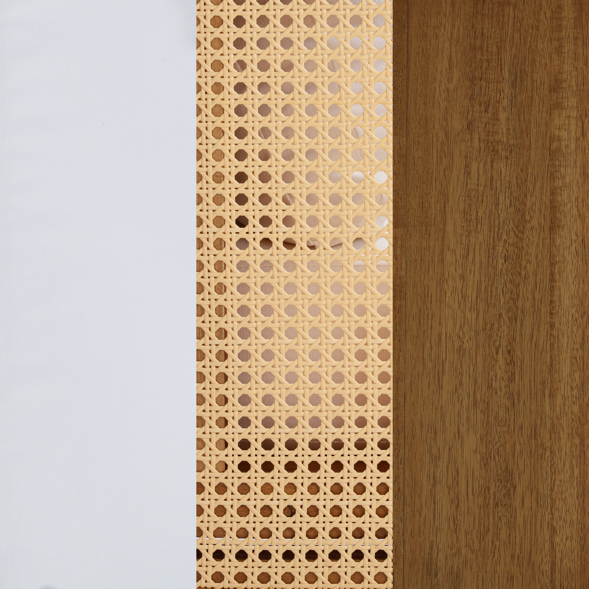 A close-up of three vertical panels: white fabric on the left, woven cane in the center, and brown wood on the right.