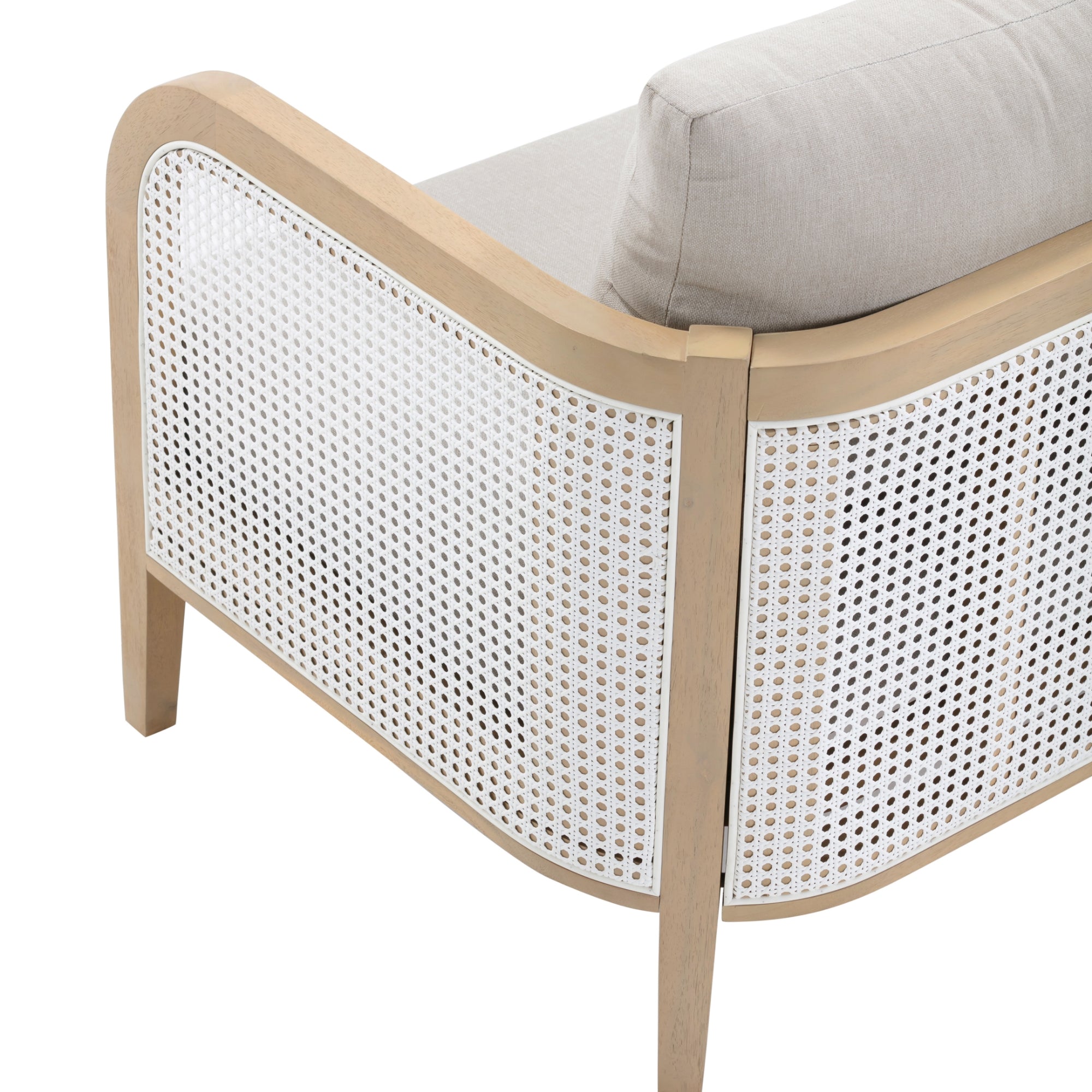 A close-up of the back and side of a wooden chair with a light beige cushion and white woven cane paneling. The chair has smooth, rounded edges and a modern, minimalist design.