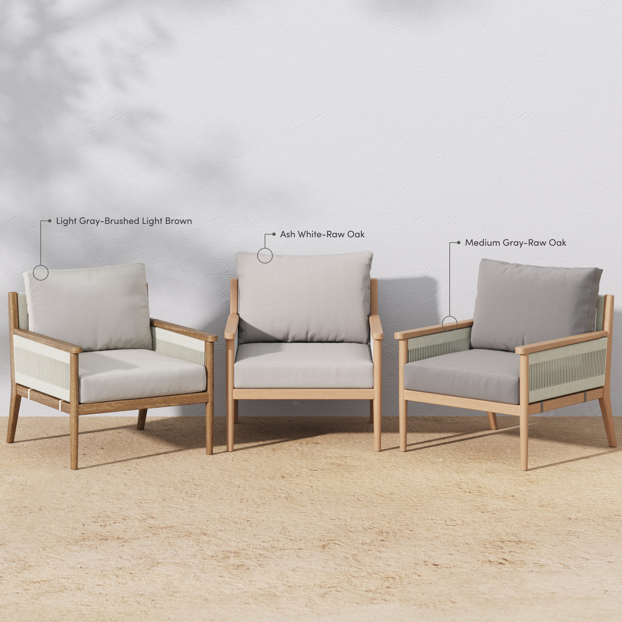 Three wooden armchairs with cushions are arranged outdoors against a white wall, each labeled by color: light gray-brushed light brown, ash white-raw oak, and medium gray-raw oak. Shadows fall softly on the wall.