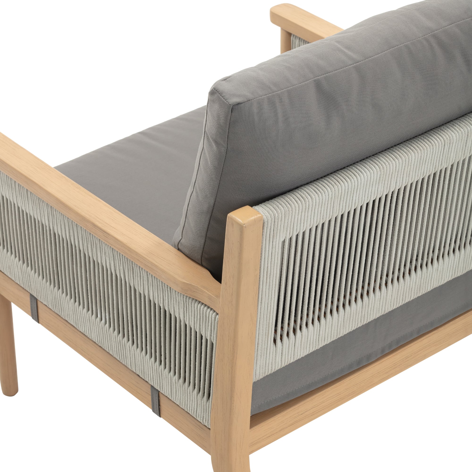 A close-up of a modern armchair with light wood frame, grey cushions, and a backrest made of tightly woven light-colored rope.