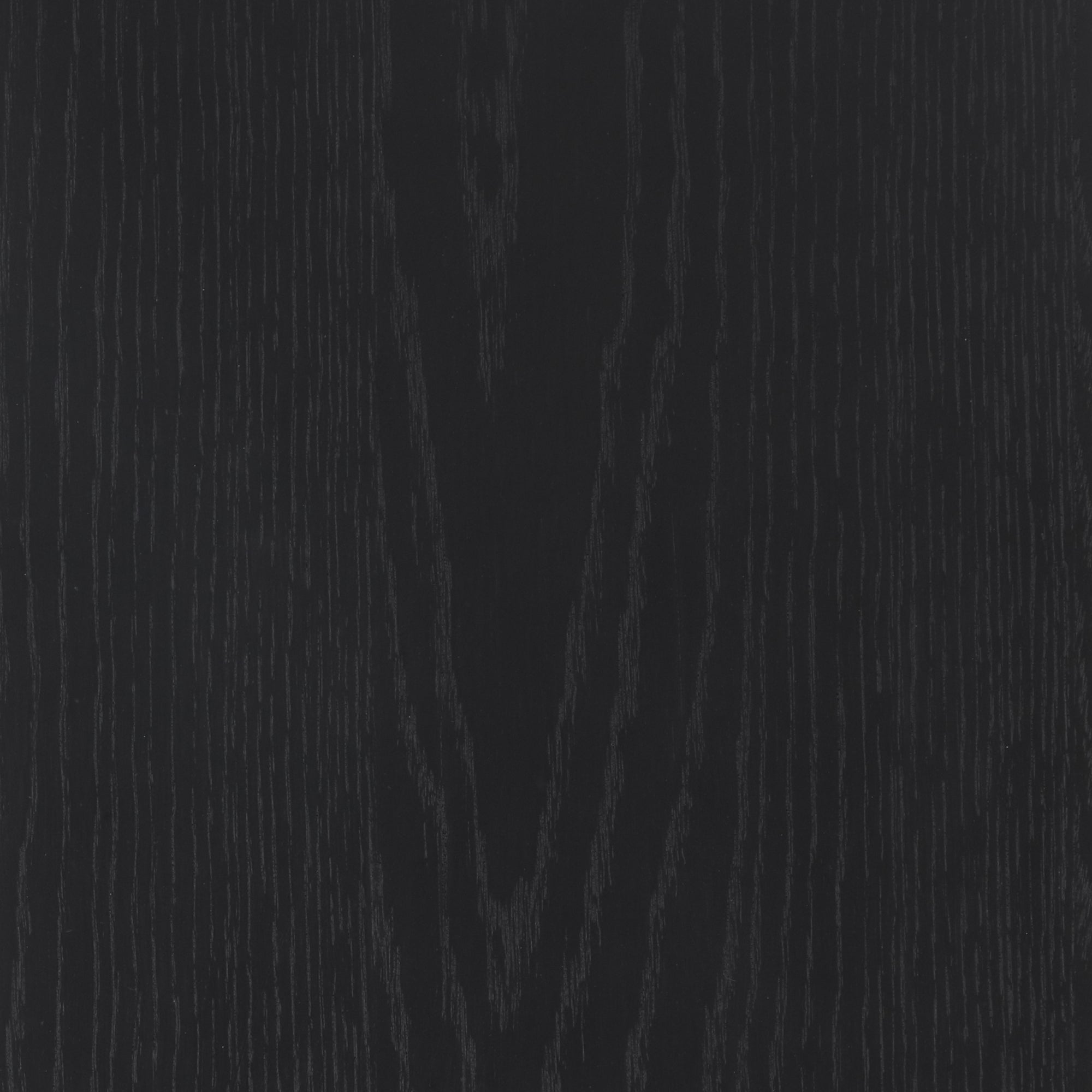 Close-up of a dark wooden surface with visible grain patterns running vertically, creating a natural texture and subtle contrast in shades of black and dark gray.
