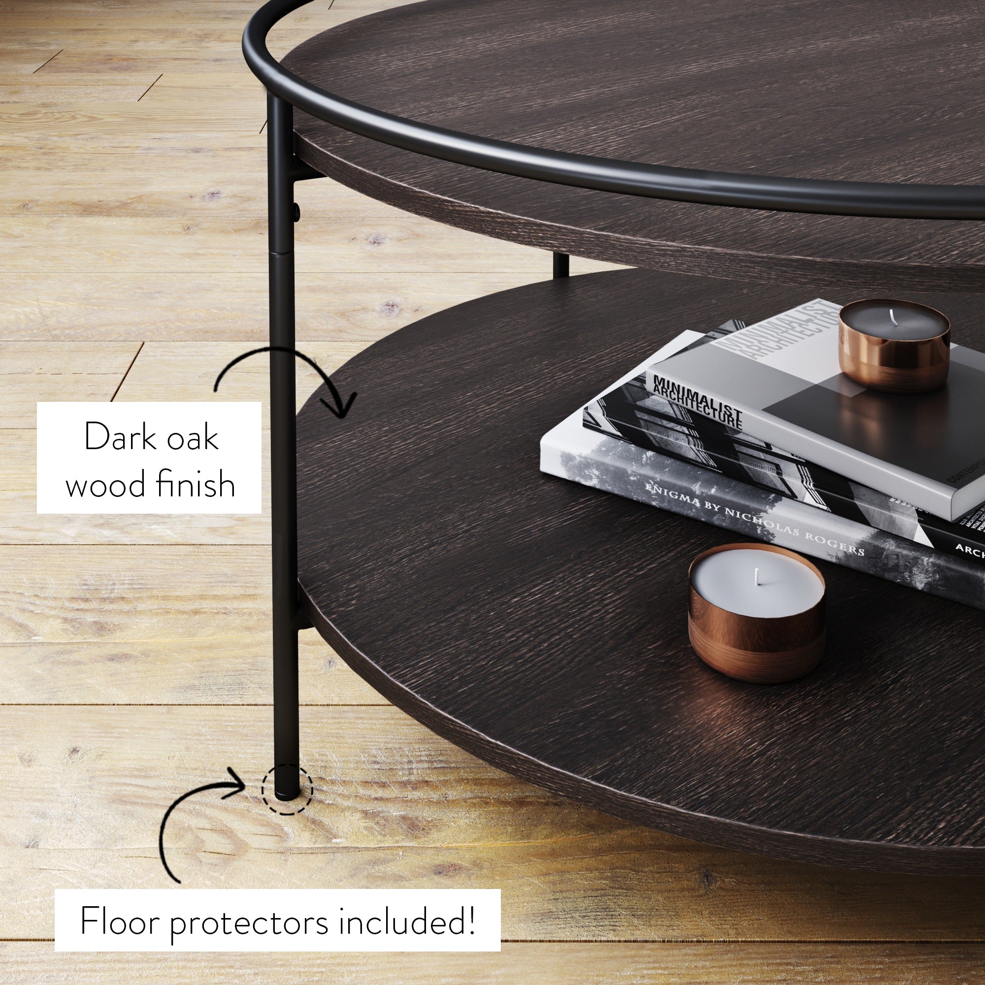 A round, dark oak coffee table with metal legs is shown on a wood floor. The table has a lower shelf with books and a candle. Arrows point to text: Dark oak wood finish and Floor protectors included!.