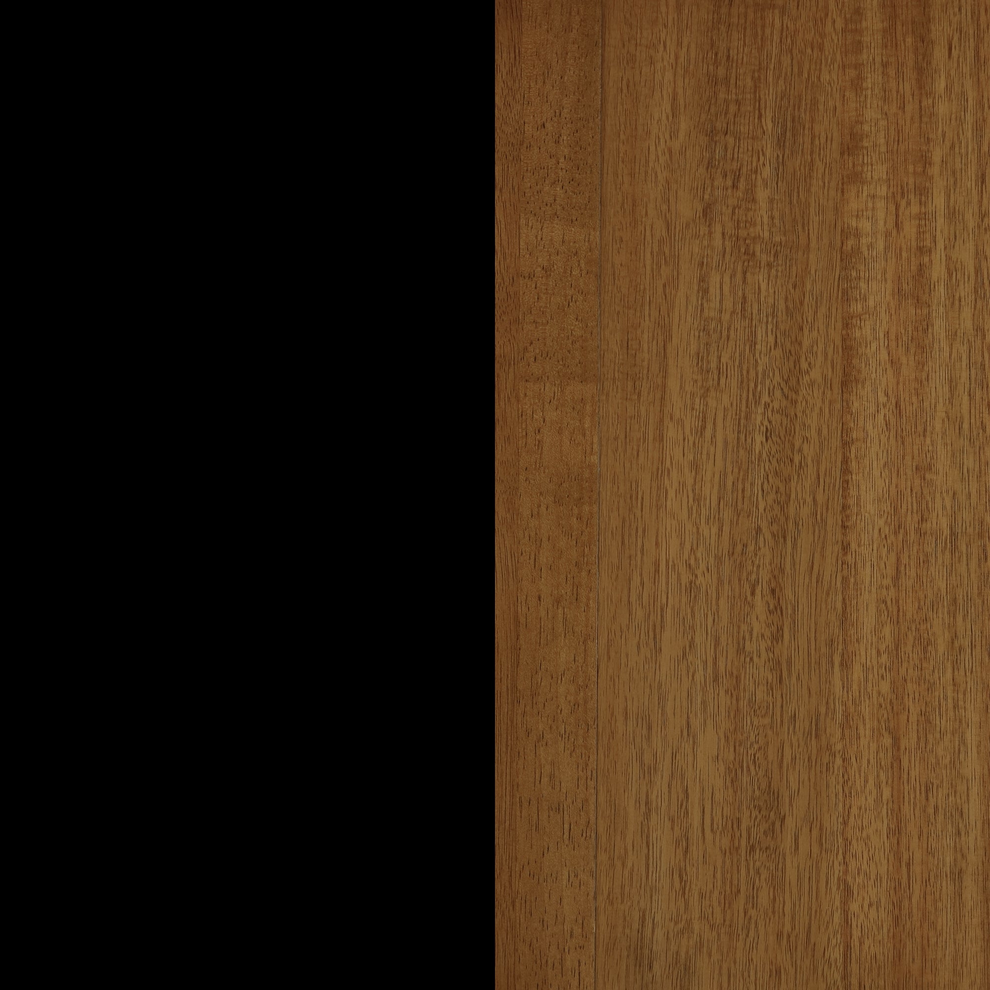 A vertical split image showing a solid black area on the left side and a natural light brown wooden surface with visible grain on the right side.