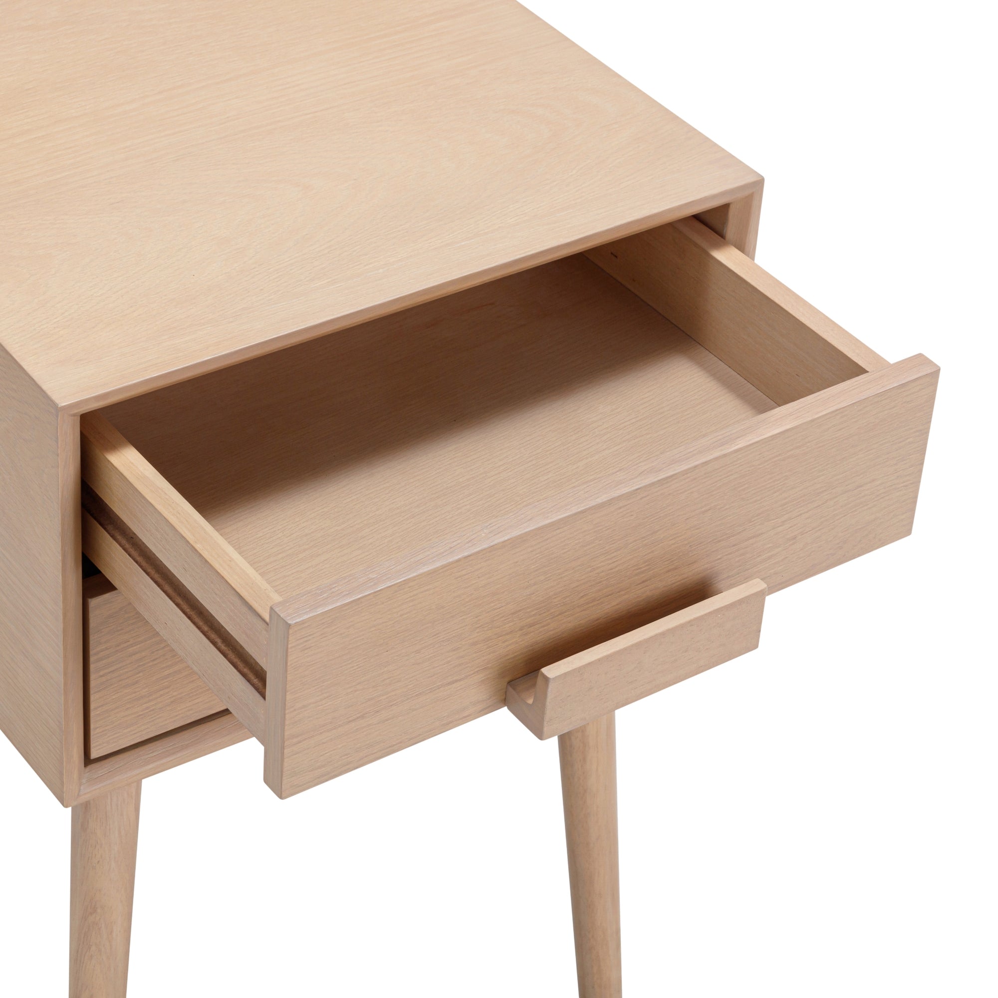 A light wood nightstand with a single drawer partially open, showing an empty interior. The nightstand has simple, straight legs and a minimalist design.